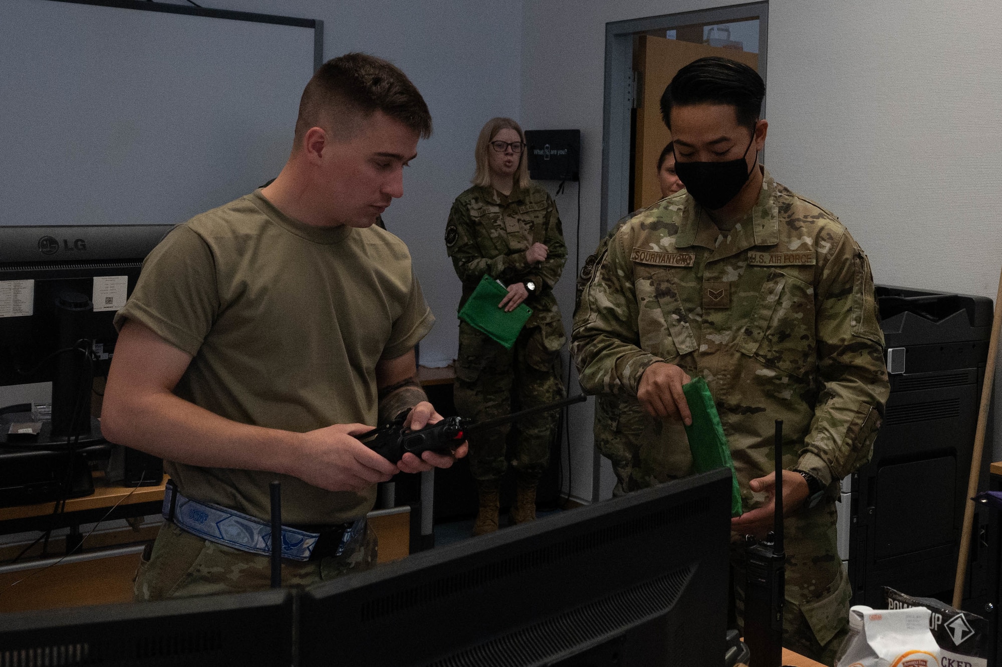 Airmen distribute car keys.