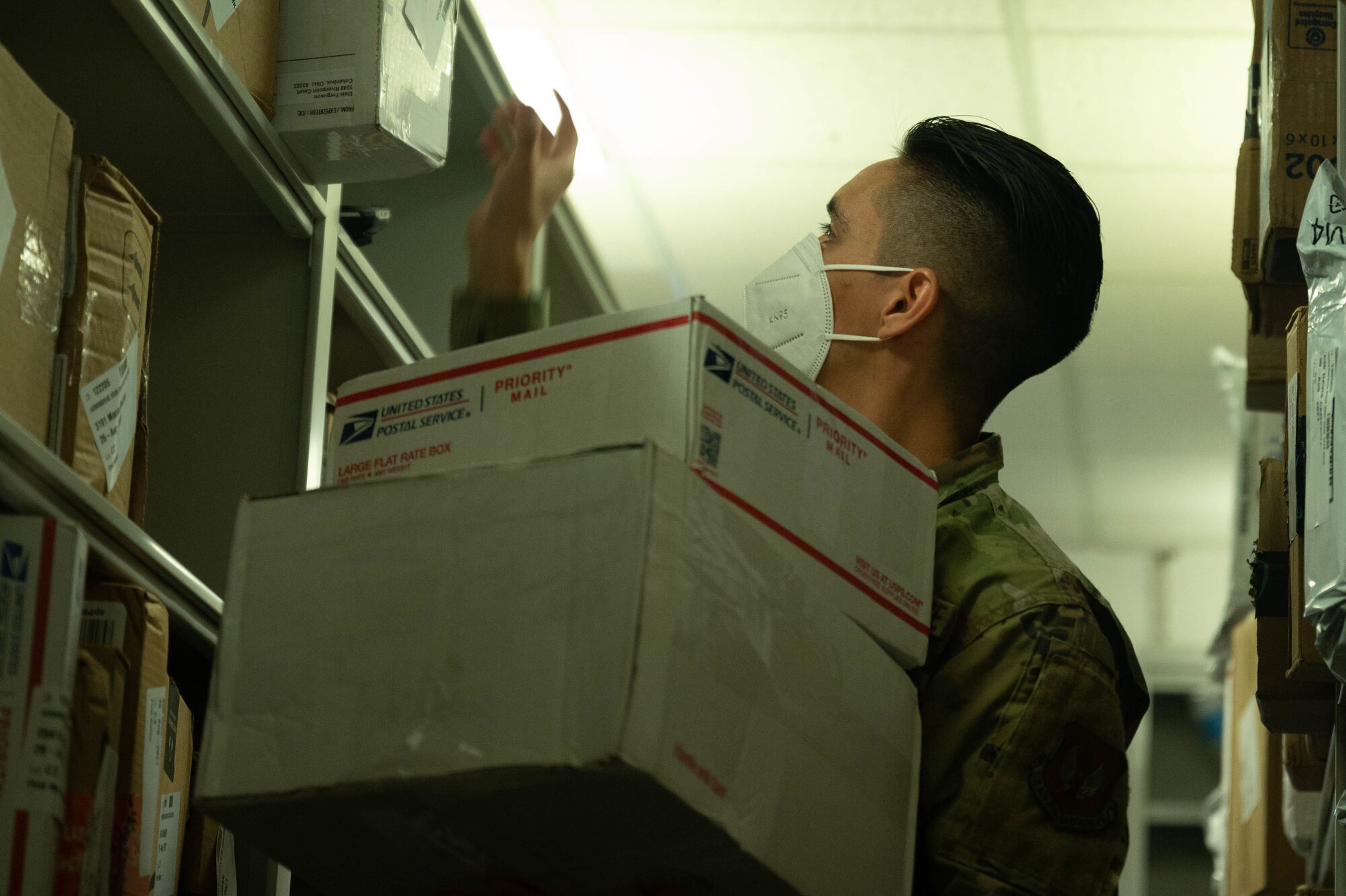 Airman collects mail.