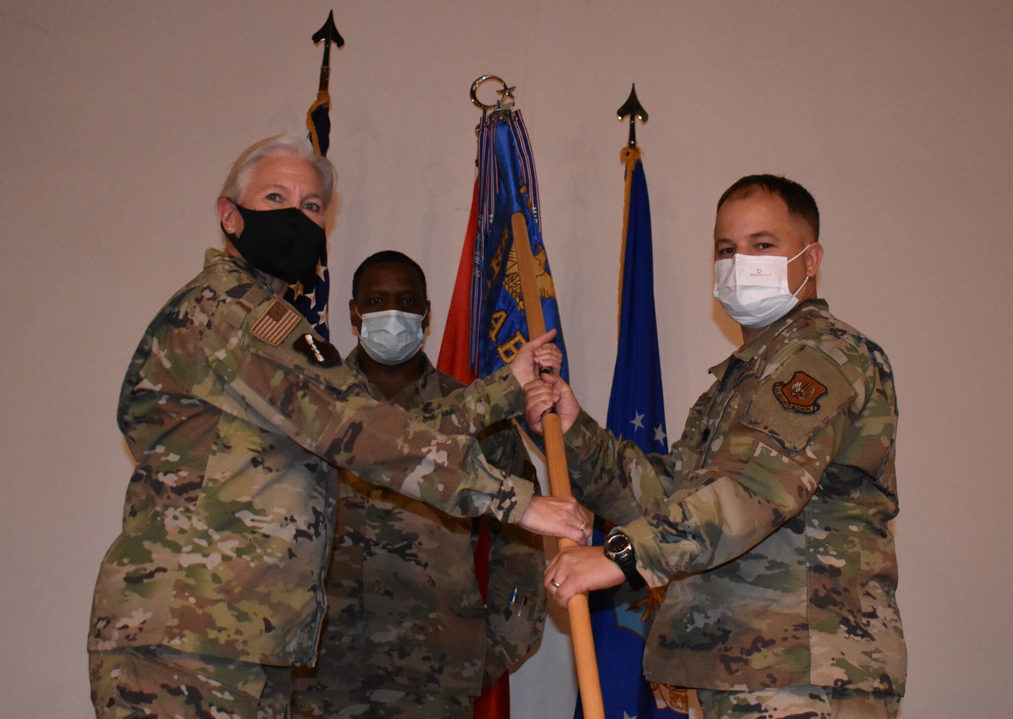 change of command guidon being passed