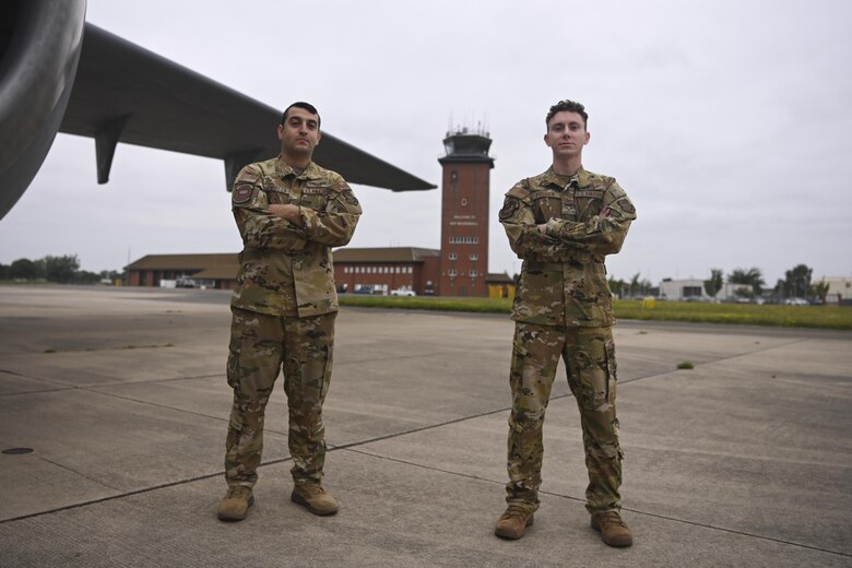 U.S. Air Force Tech. Sgt. Matteo Piruzza, 9th Air Refueling Squadron boom operator, left, and Senior Airman Daniel Proben, 9th ARS boom operator, were based out of Royal Air Force Mildenhall, England, while participating in Operation Allies Refuge. RAF Mildenhall served as a staging area for the 60th Air Mobility Wing in their evacuation of eligible foreigners and vulnerable Afghans. (U.S. Air Force photo by Senior Airman Joseph Barron)