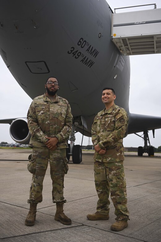 U.S. Air Force Airman 1st Class Lederion Carter, 660th Aircraft Maintenance Squadron crew chief, left, and Tech. Sgt. Estebon Corronado, 660th AMXS crew chief, provided maintenance for a KC-10 Extender aircraft assigned to the 60th Air Mobility Wing, Travis Air Force Base, California, participaing in the evacuation of eligible foreigners and vulnerable Afghans. Carter and Corronado were based out of Royal Air Force Mildenhall, England, during their support of Operation Allies Refuge. (U.S. Air Force photo by Senior Airman Joseph Barron)