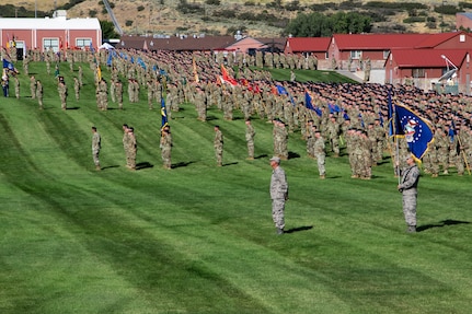 Service members in formation at Camp Williams
