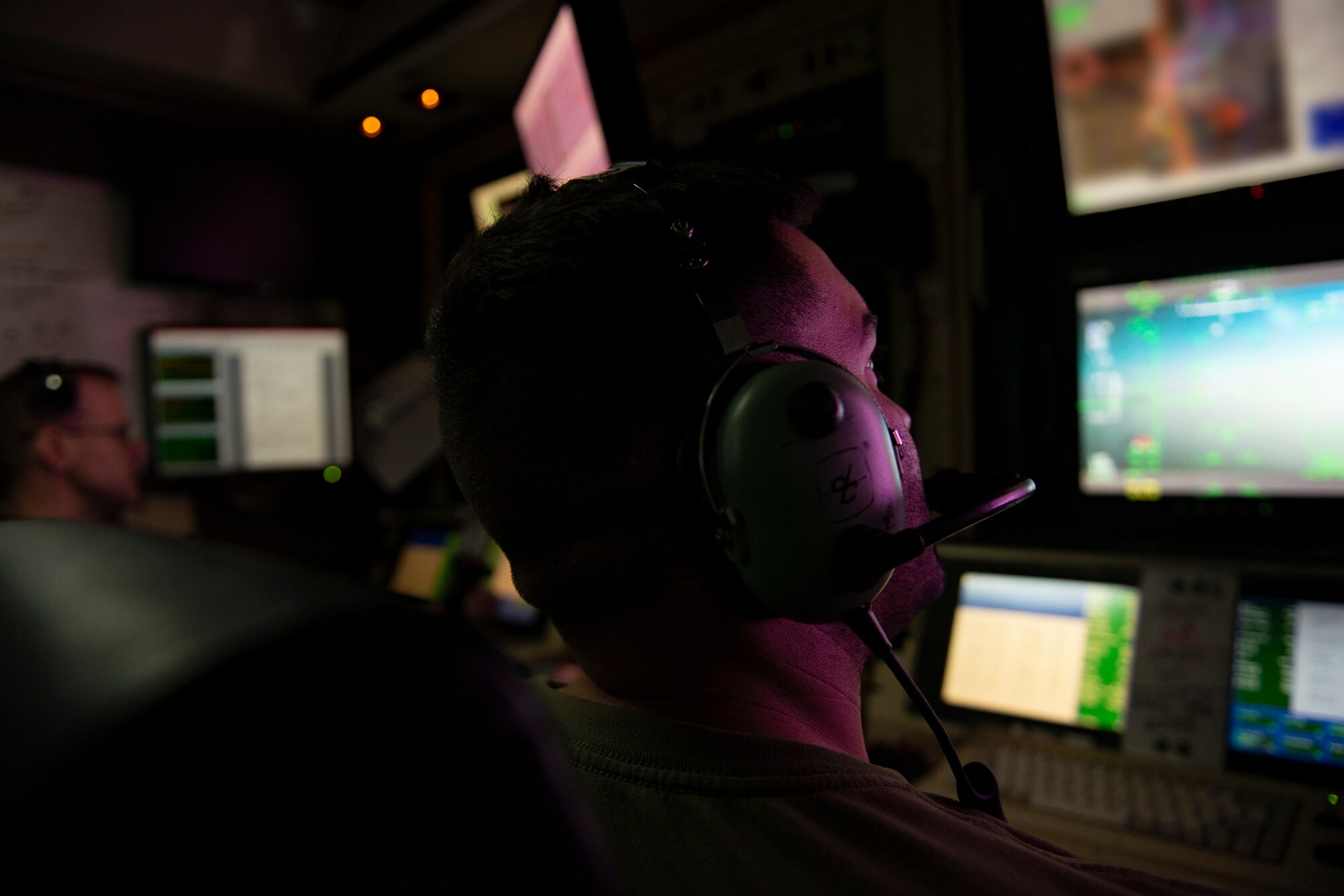 A photo of an Airman looking at a screen