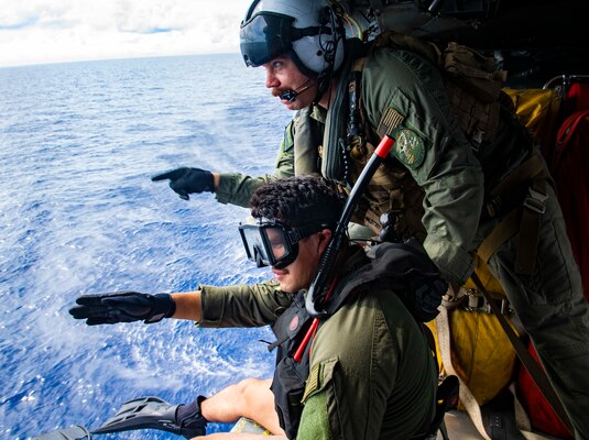 Naval Aircrewmen (Helicopter) 1st Matthew Brickley from Peoria, Ariz. and Naval Aircrewmen 2nd Class Nicolas Lopez from Artesia, Calif., conducts a search and rescue (SAR) exercise inside of a MH-60S Seahawk helicopter assigned to the “Blackjacks” of Helicopter Sea Combat Squadron (HSC) 21 aboard the Independence-variant littoral combat ship USS Tulsa (LCS 16), Sep. 05, 2021.