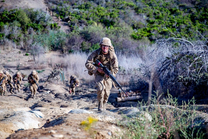 U.S. Marine Corps recruit Lucas Leis, a recruit with Delta Company, 1st Recruit Training Battalion runs up a hill during the crucible at Marine Corps Base Camp Pendleton, Calif., Sept. 1, 2021. T
