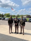 Soldiers pose in their dress uniforms for a photo.