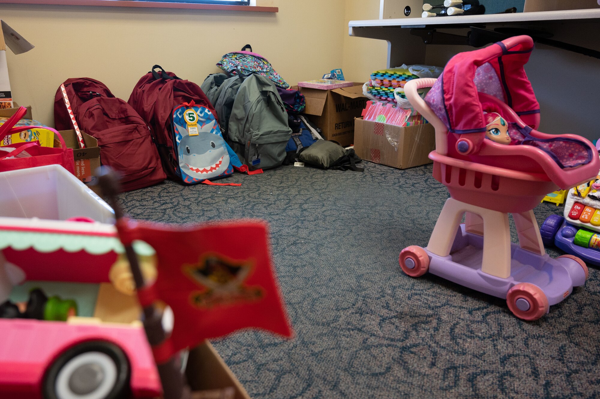 Toys being donated to Afghan refugees arriving as part of Operation Allies Welcome are stored in the Holloman donation center Sept. 3, 2021 on Holloman Air Force Base, New Mexico. The Department of Defense, through U.S. Northern Command, and in support of the Department of Homeland Security, is providing transportation, temporary housing, medical screening, and general support for up to 50,000 Afghan evacuees at suitable facilities, in permanent or temporary structures, as quickly as possible. This initiative provides Afghan personnel essential support at secure locations outside Afghanistan. (U.S. Air Force photo by Tech. Sgt. BreeAnn Sachs)