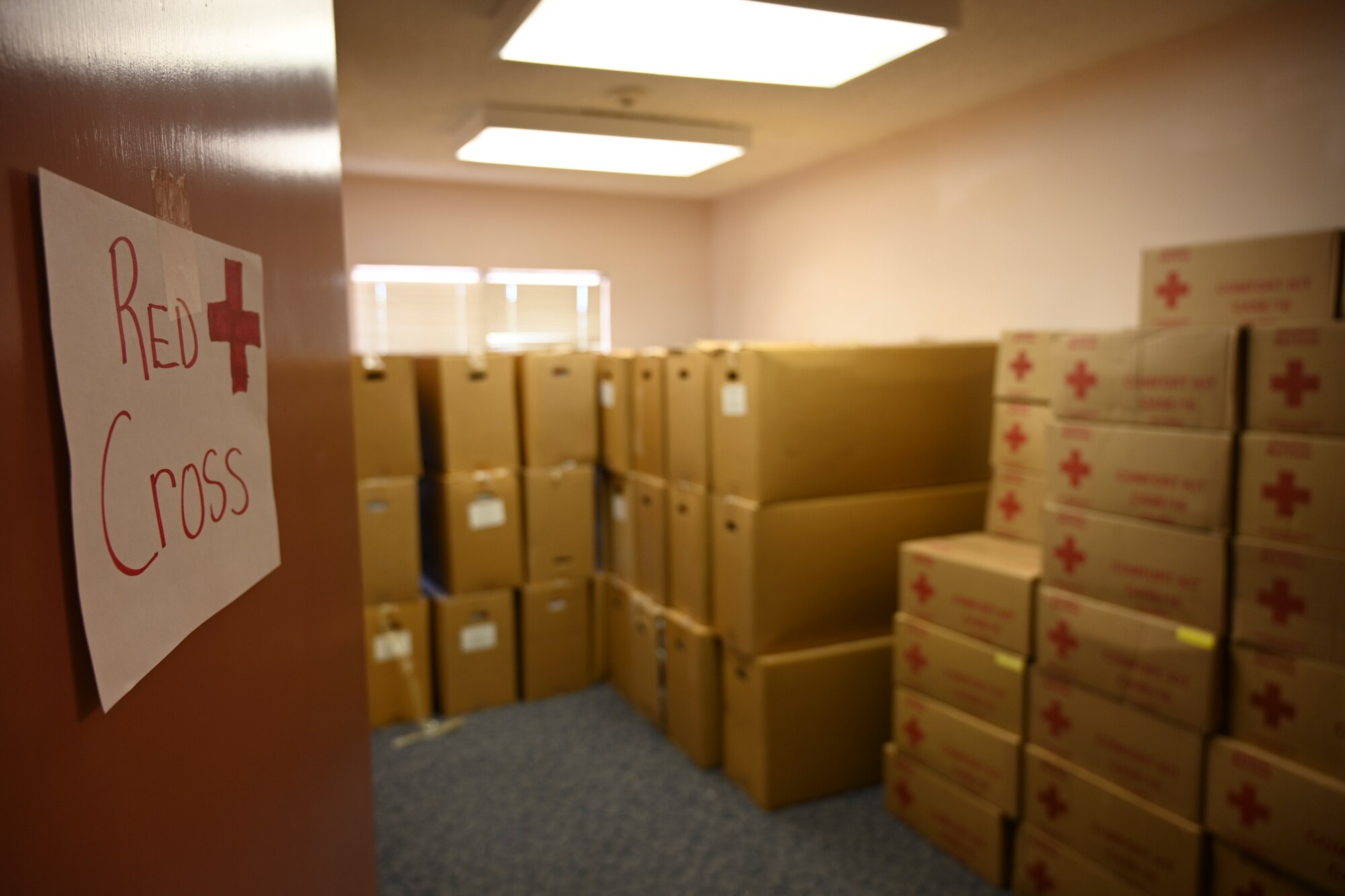 Red Cross donations are stored at the Holloman donation center Sept. 3, 2021 on Holloman Air Force Base, New Mexico. Over 110 tons of donations were collected in approximately nine days to be given to Afghan refugees arriving in support of Operation Allies Welcome. The Department of Defense, through U.S. Northern Command, and in support of the Department of Homeland Security, is providing transportation, temporary housing, medical screening, and general support for up to 50,000 Afghan evacuees at suitable facilities, in permanent or temporary structures, as quickly as possible. This initiative provides Afghan personnel essential support at secure locations outside Afghanistan. (U.S. Air Force photo by Airman 1st Class Adrian Salazar)