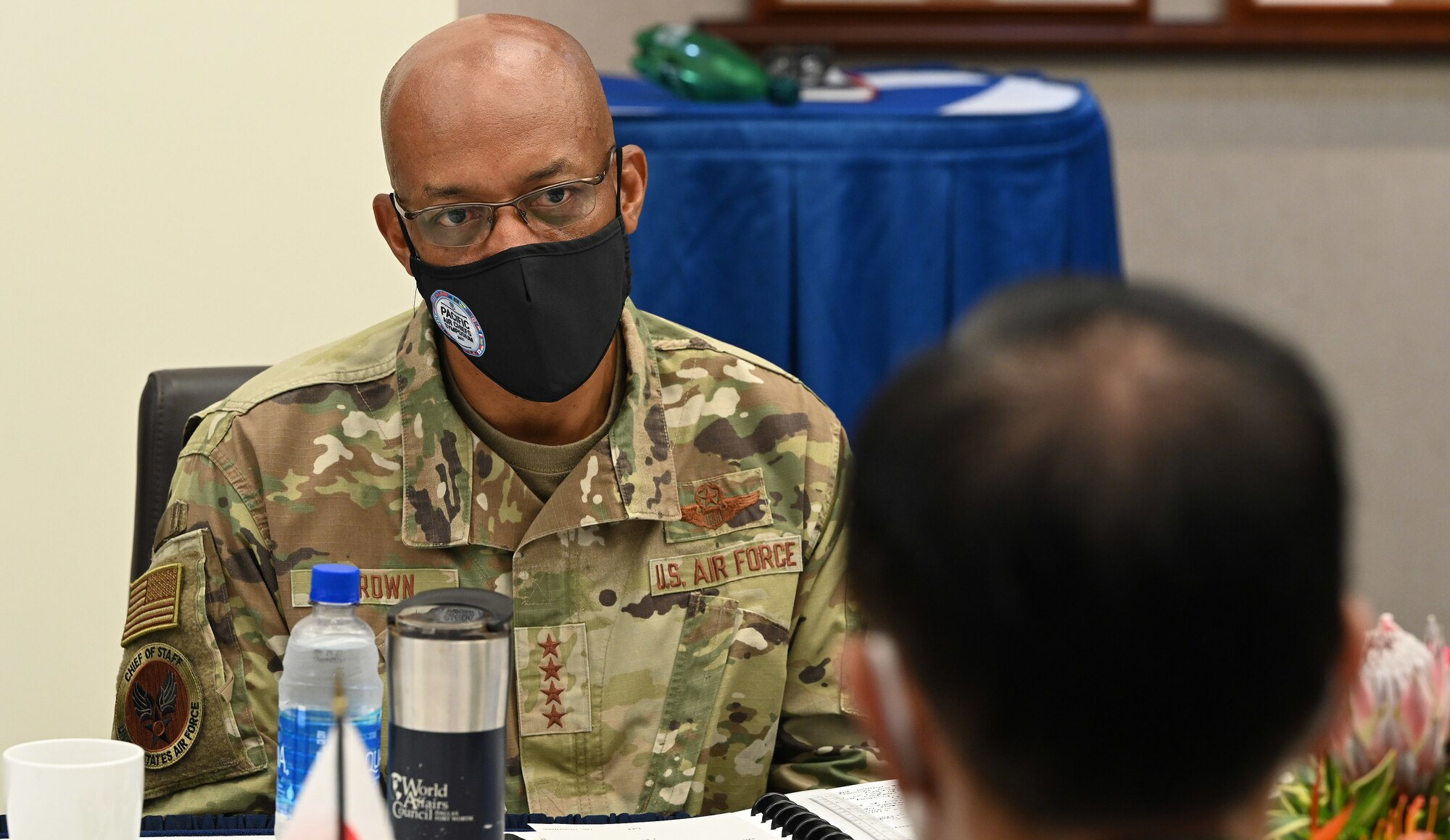 Photo of a US Air Force general listening during a conversation