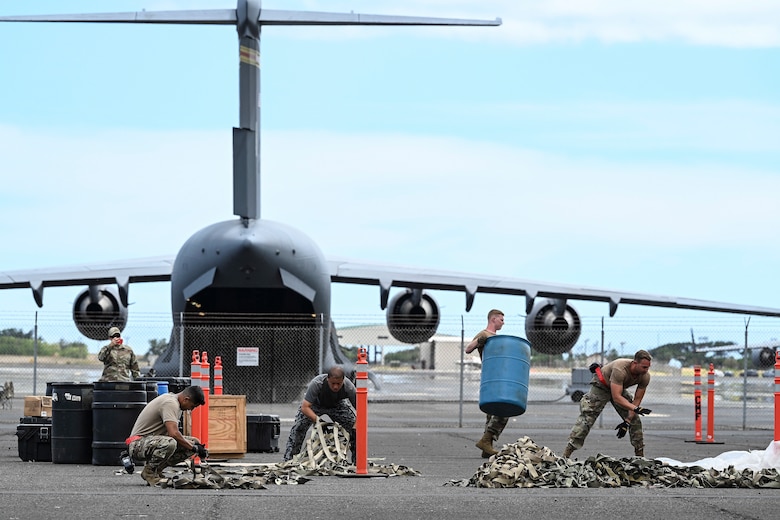 Photo of Airmen performing a demonstration.