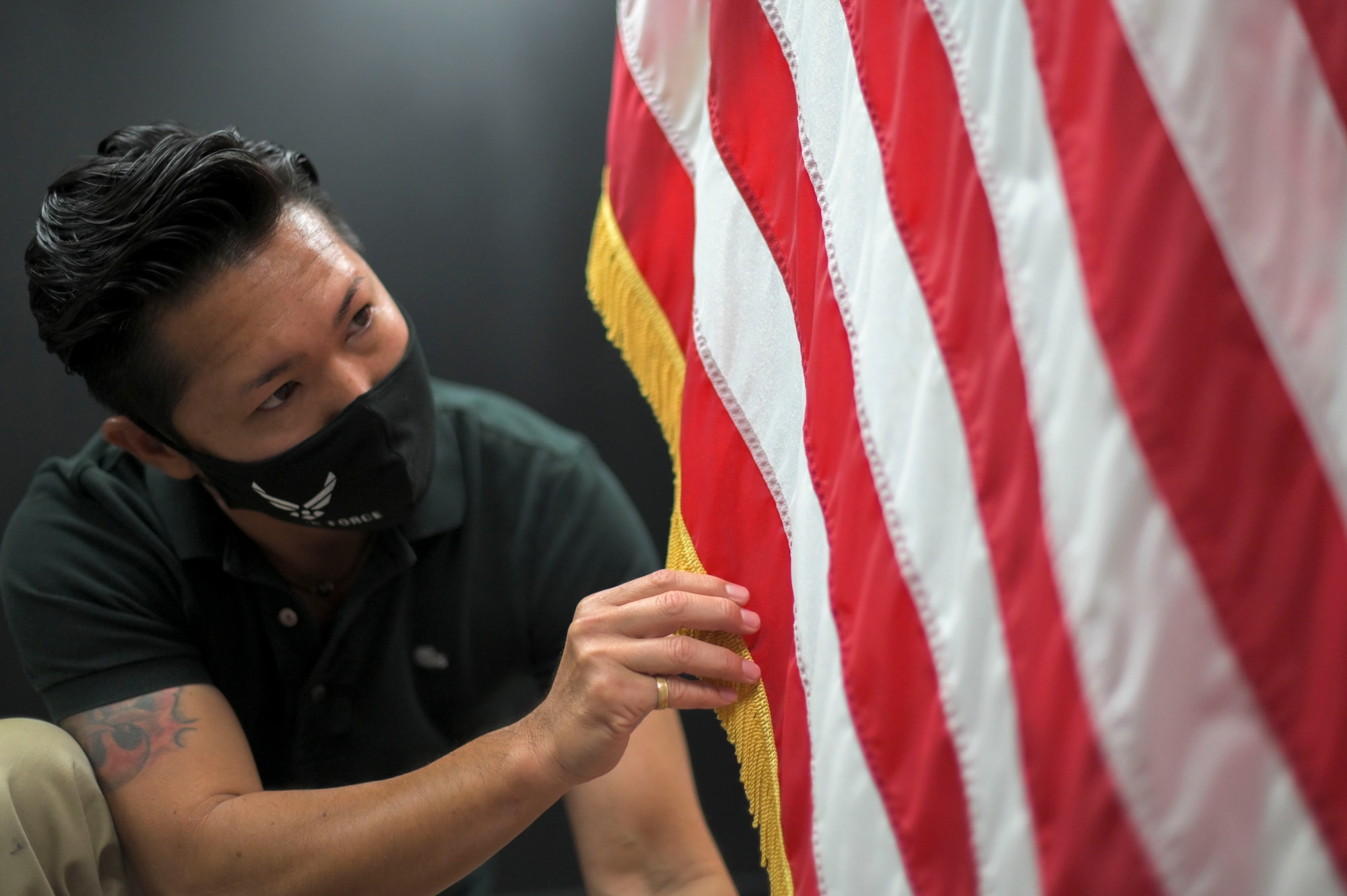 Photographer arranges american flag for photo