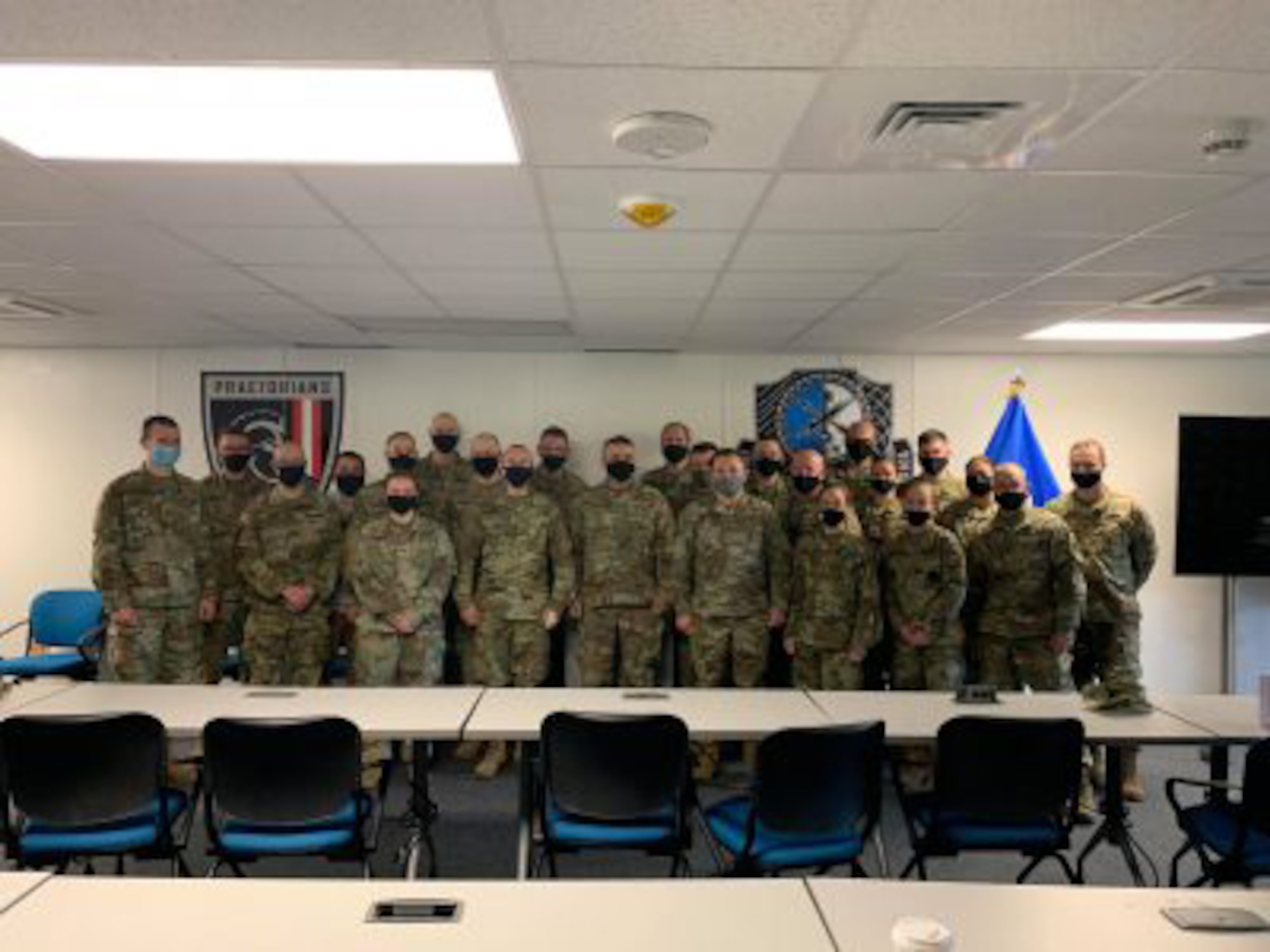 Soldiers of the Wisconsin Army National Guard’s Detachment 1, 176th Cyber Protection Team, with Maj. Gen. Paul Knapp, Wisconsin’s adjutant general, following their external evaluation exercise prior to deploying. The team, which includes Soldiers from Minnesota, Illinois and Virginia, is in the midst of a mobilization to cyberspace operations in support of U.S. Cyber Command and Cyber National Mission Force requirements.