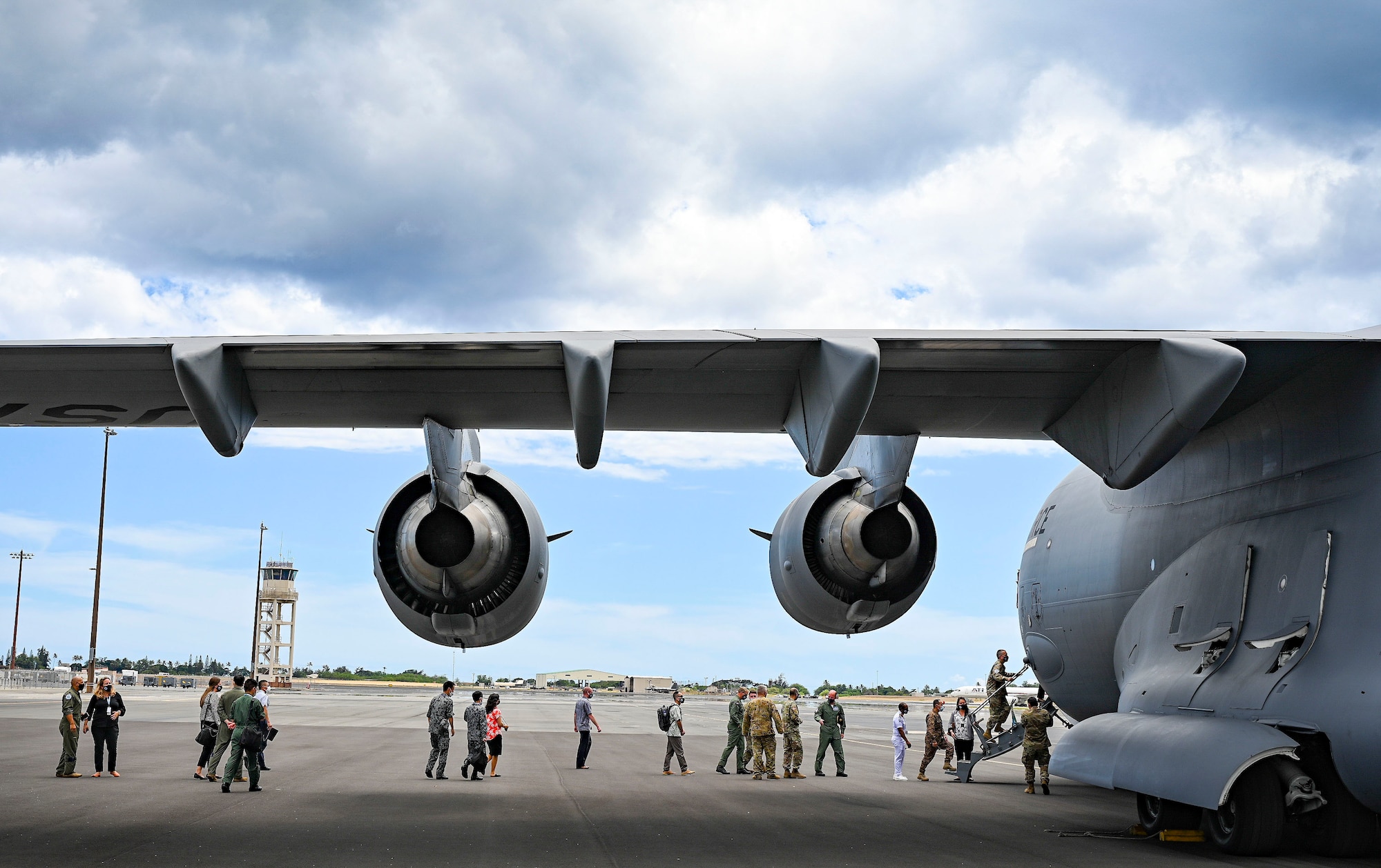 Pacific Air Forces Airmen and air chiefs from across the Indo-Pacific region line up to tour a C-17 Globemaster III during an Air Mobility Command Rodeo for Pacific Air Chiefs Symposium 2021 at Joint Base Pearl Harbor-Hickam, Hawaii, Aug. 30, 2021. The symposium provided an opportunity for air chiefs across the Indo-Pacific region to share dialogue and to build mutual understanding of regional perspectives through bilateral engagements and multinational panels and meetings.