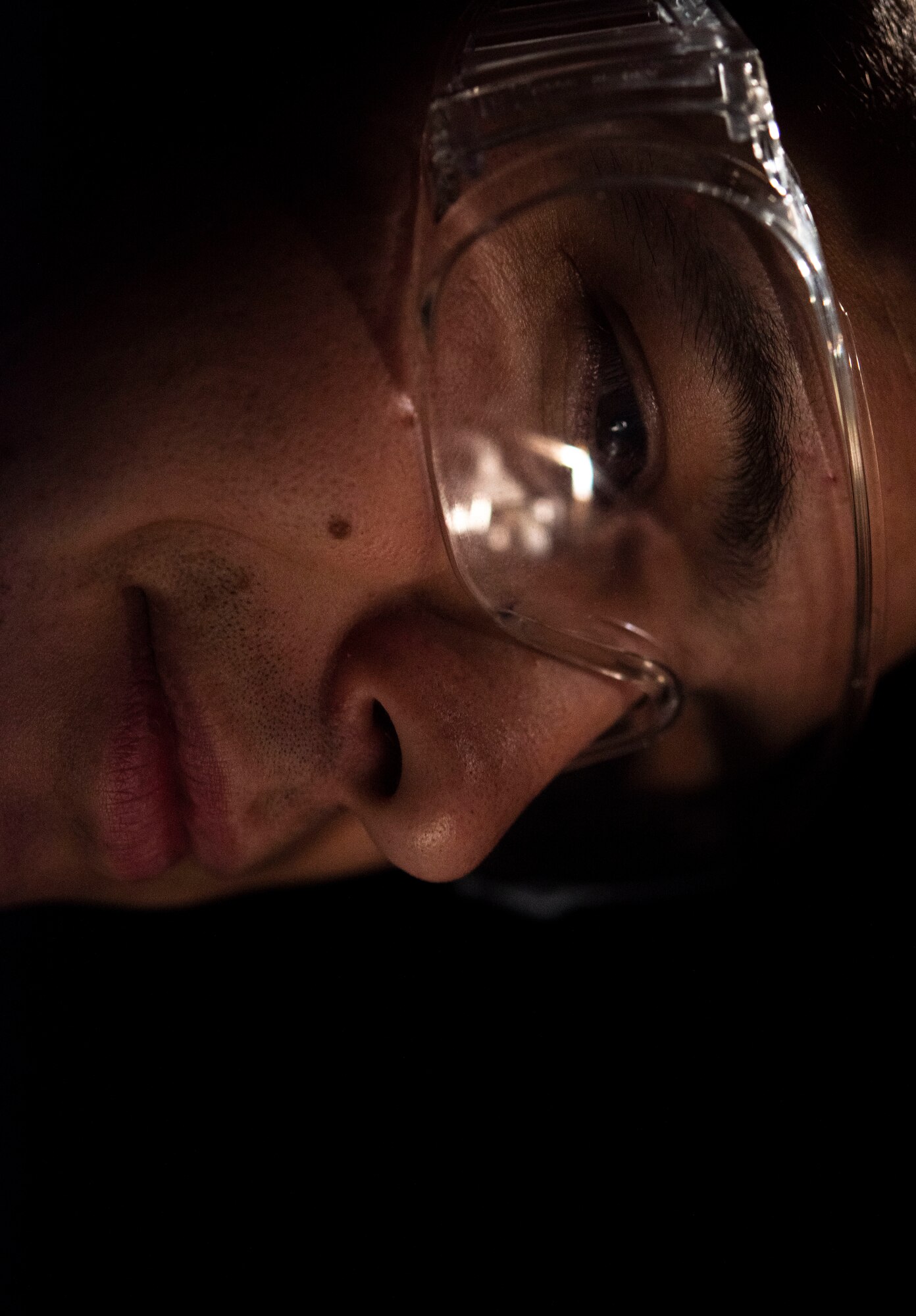 An Airman solders wires.