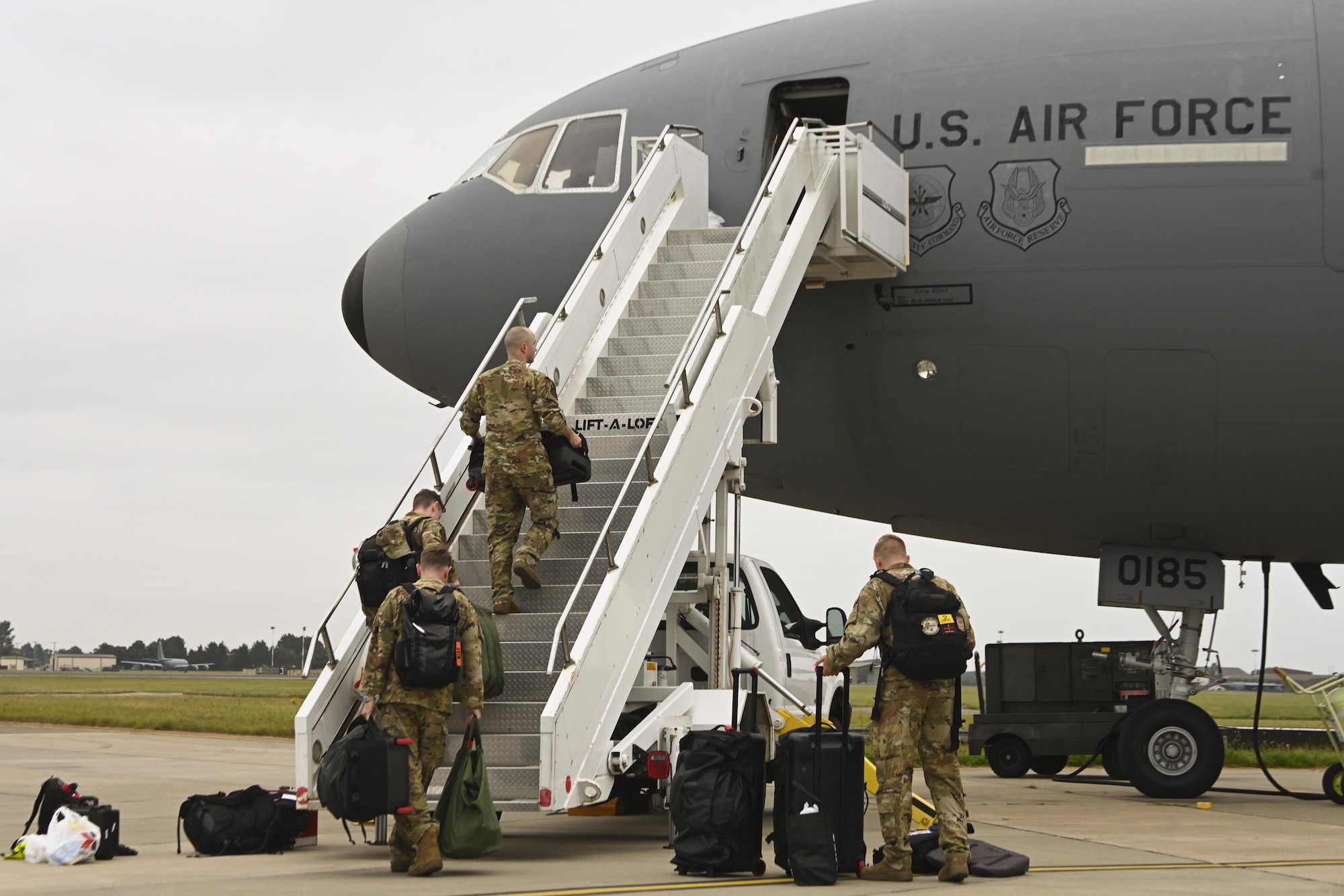 U.S. Air Force Airmen assigned to the 60th Air Mobility Wing, Travis Air Force Base, California, board a KC-10 Extender aircraft before a flight at Royal Air Force Mildenhall, England, Sept. 2, 2021. RAF Mildenhall served as a staging area for the 60th AMW in their evacuation of eligible foreigners and vulnerable Afghans during Operation Allies Refuge. (U.S. Air Force photo by Senior Airman Joseph Barron)