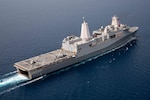 USS Arlington (LPD 24) sails off the coast of Haiti with an NH90 NATO Frigate Helicopter, left, attached to the Royal Netherlands Navy, and a U.S. Navy MH-60S Sea Hawk helicopter on the flight deck, Aug. 30, 2021.