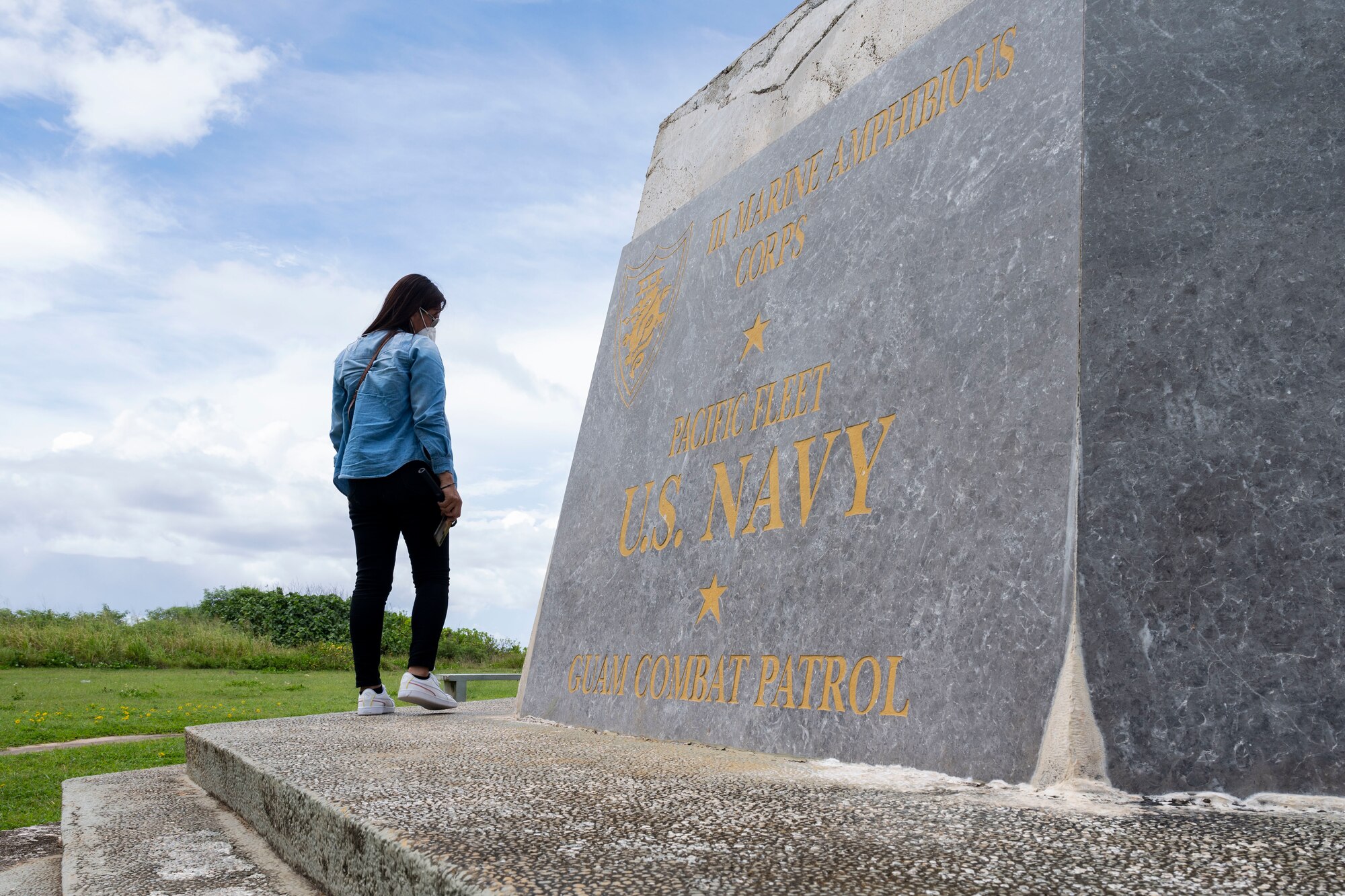 A student attending the Aircraft Maintenance Officer Course Event examines a memorial at the War in the Pacific National Park, Guam, Aug. 14, 2021.