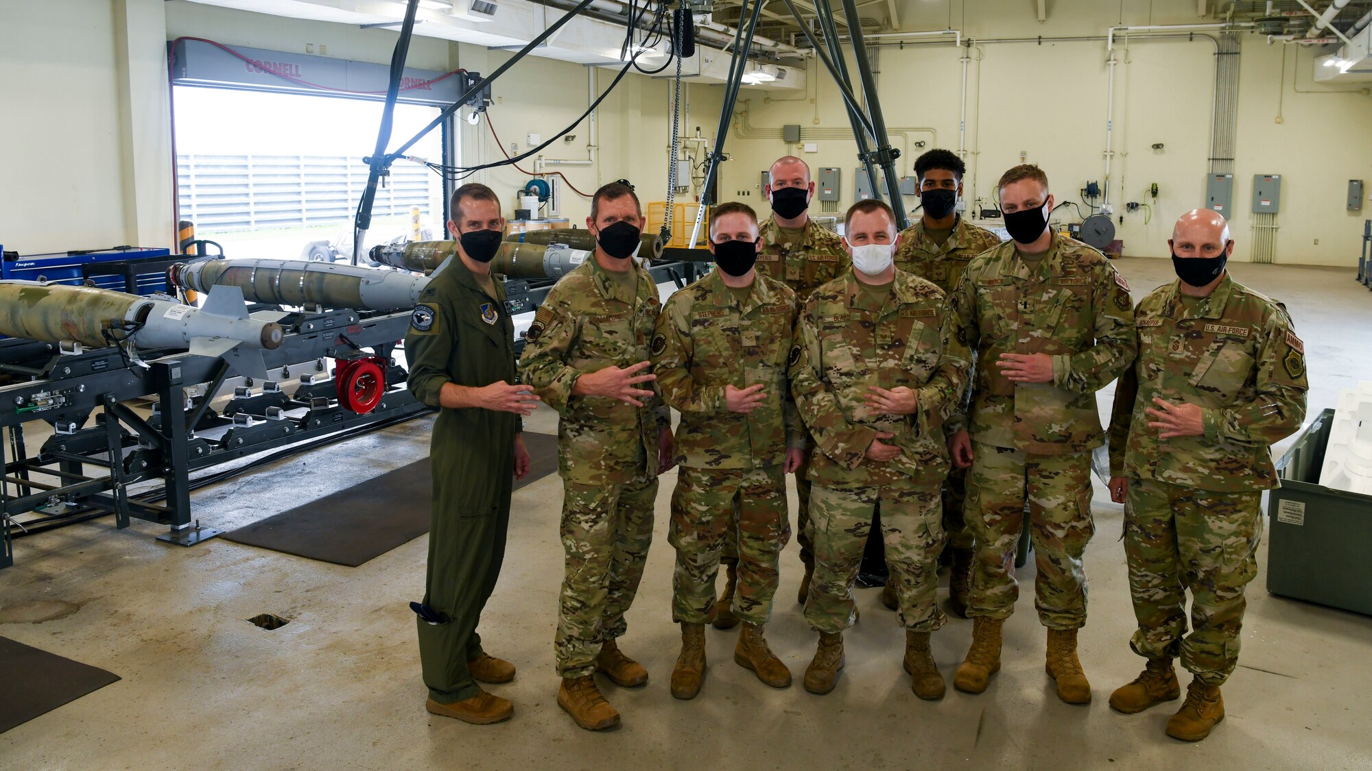 Airmen pose for a photo.
