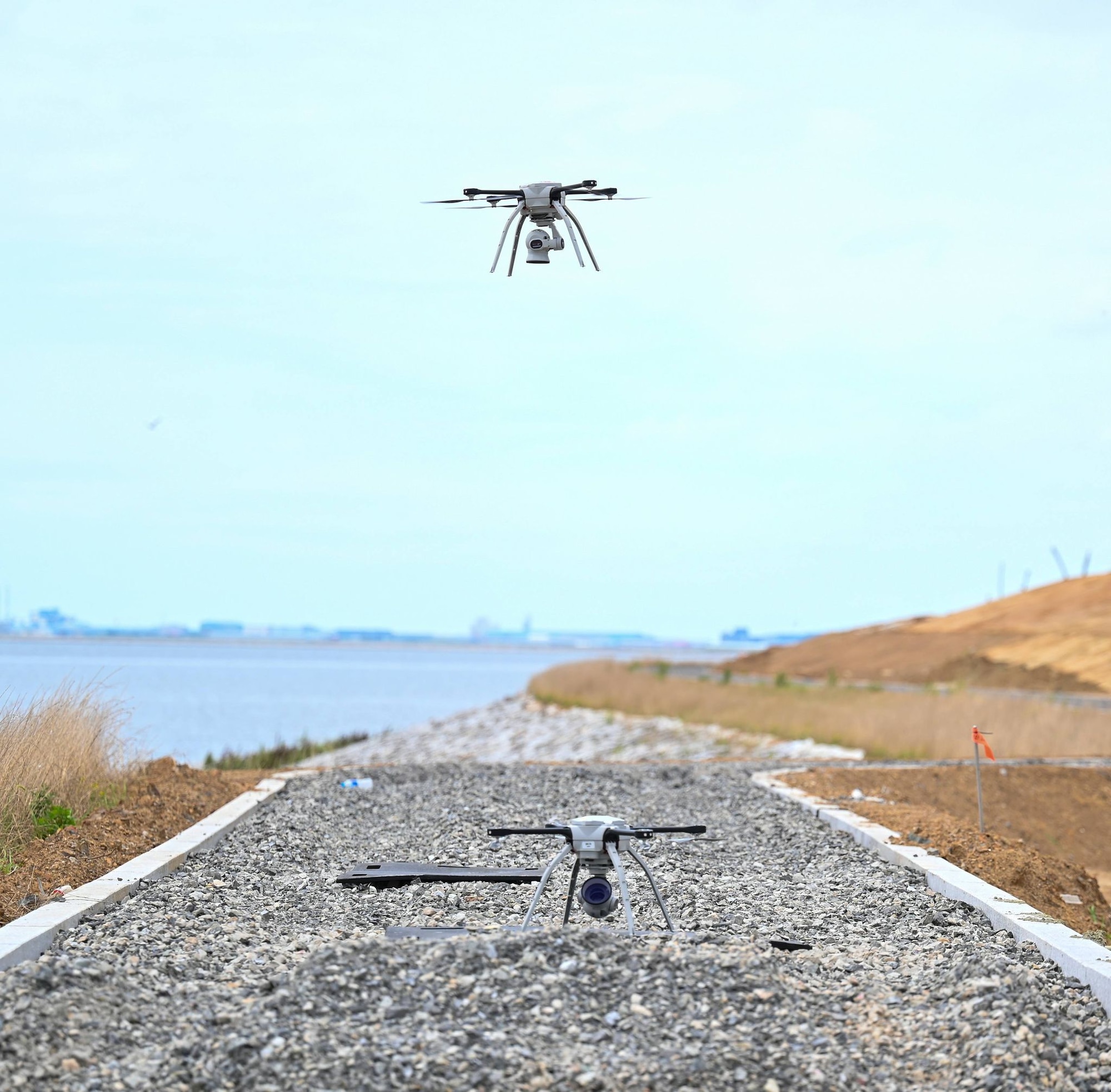 A drone hovers during water recovery operations.