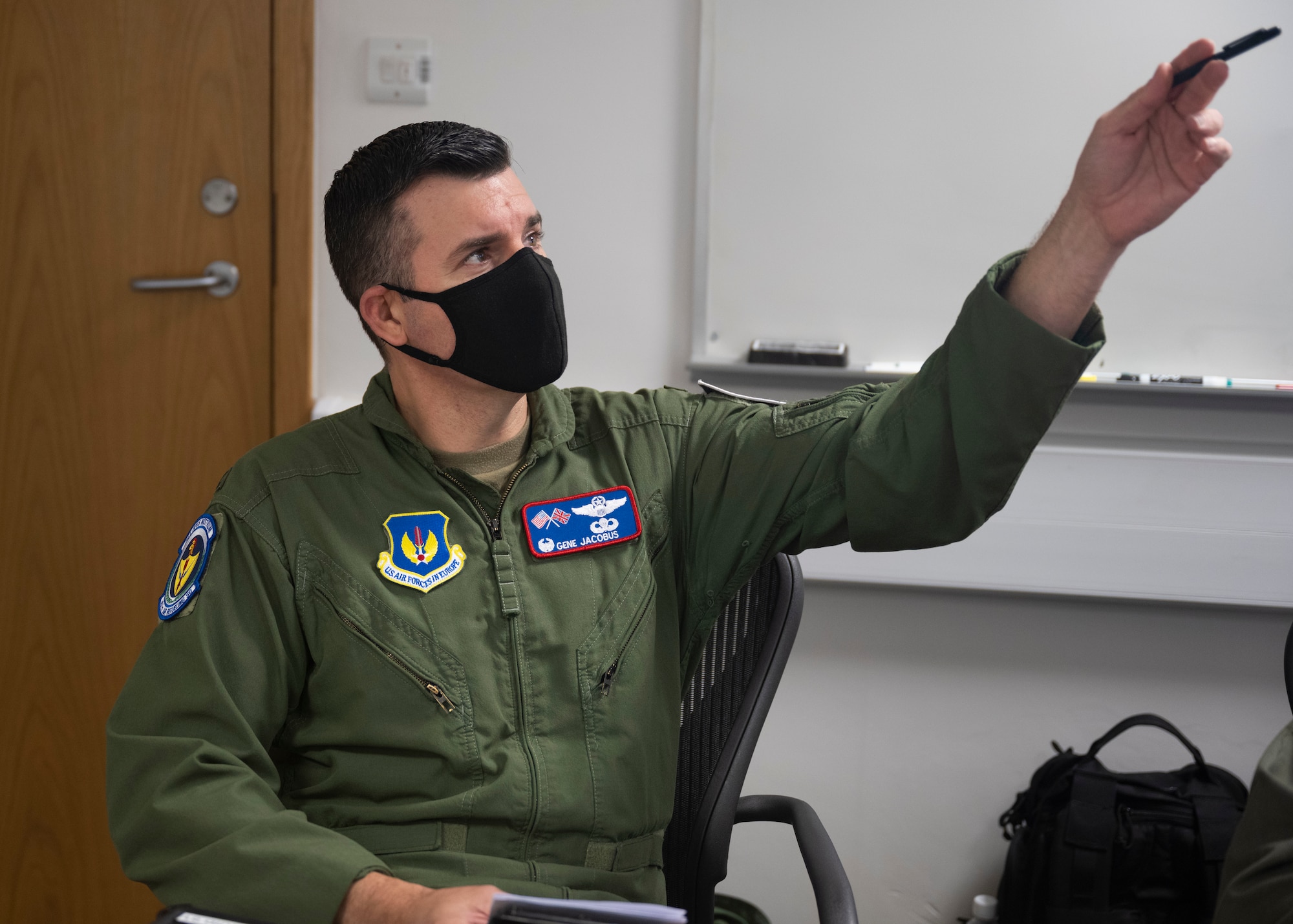 U.S. Air Force Col. Gene Jacobus, 100th Air Refueling Wing commander, completes a pre-flight briefing at Royal Air Force Mildenhall, England, Sept. 1, 2021. Pre-flight briefs allowed the crew to review factors such as weather, cargo and flight routes to successfully provide air refueling support throughout Europe and Africa. (U.S. Air Force photo by Airman Alvaro Villagomez)