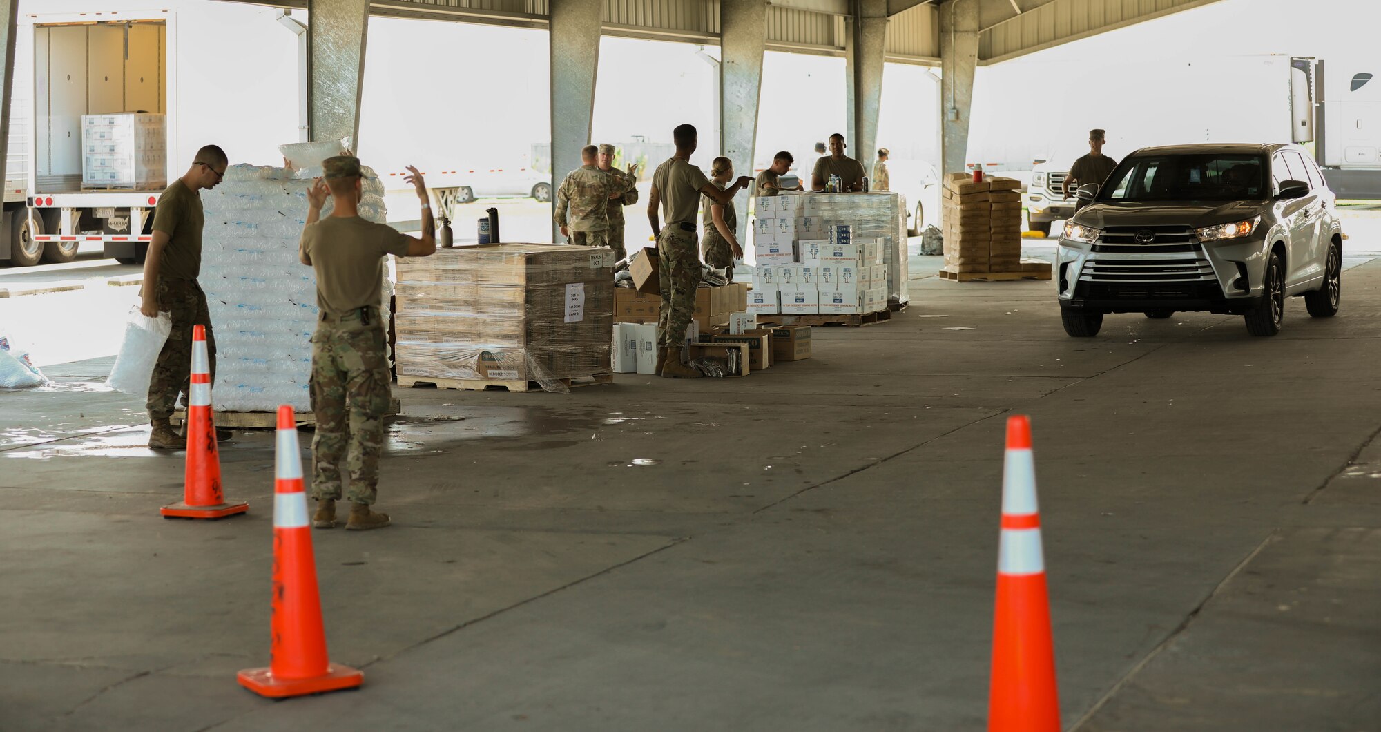 Members of the Oklahoma Army National Guard operate a point of distribution site in Donaldsonville, Louisiana, Sept. 4. The Oklahoma National Guard operates 13 PODs across seven parishes that supply local families with tarps, meals ready to eat, ice and water. (Oklahoma National Guard photo by Cpl. Reece Heck)