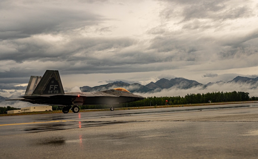 A jet taxis down a runway.