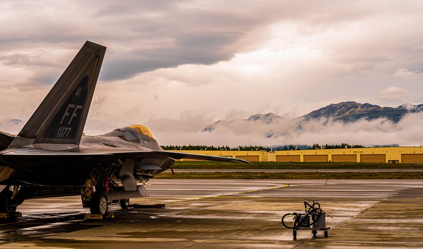 A jet is parked on the flightline.