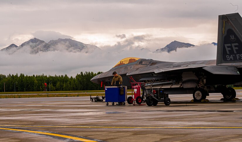 An Airman runs diagnostics for a jet.