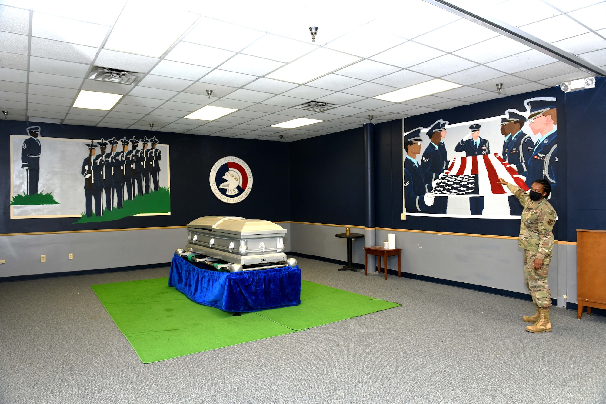 Photo shows the training room with the wall paintings depicting the honor guard.