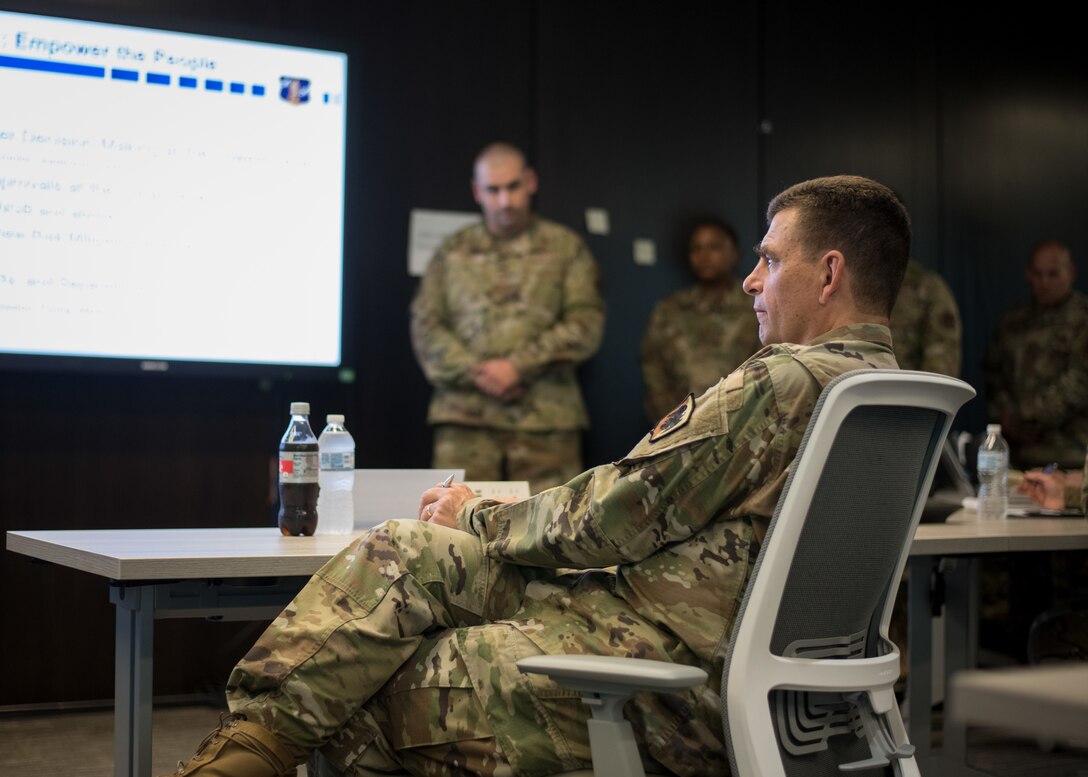 U.S. Air Force Lt. Gen. Michael A. Loh, director, Air National Guard (ANG), listens as a group of senior non-commissioned officers brief their capstone project during the Senior Noncommissioned Officer Enhancement Course at the ANG Readiness Center at Joint Base Andrews, Maryland, July 15, 2021. The first course of its kind, the curriculum is designed to empower and inspire senior enlisted leaders stationed across the 50 states, three territories, and District of Columbia to accelerate force-wide improvements and positive change. (U.S. Air National Guard photo by Tech. Sgt. Morgan R. Whitehouse)