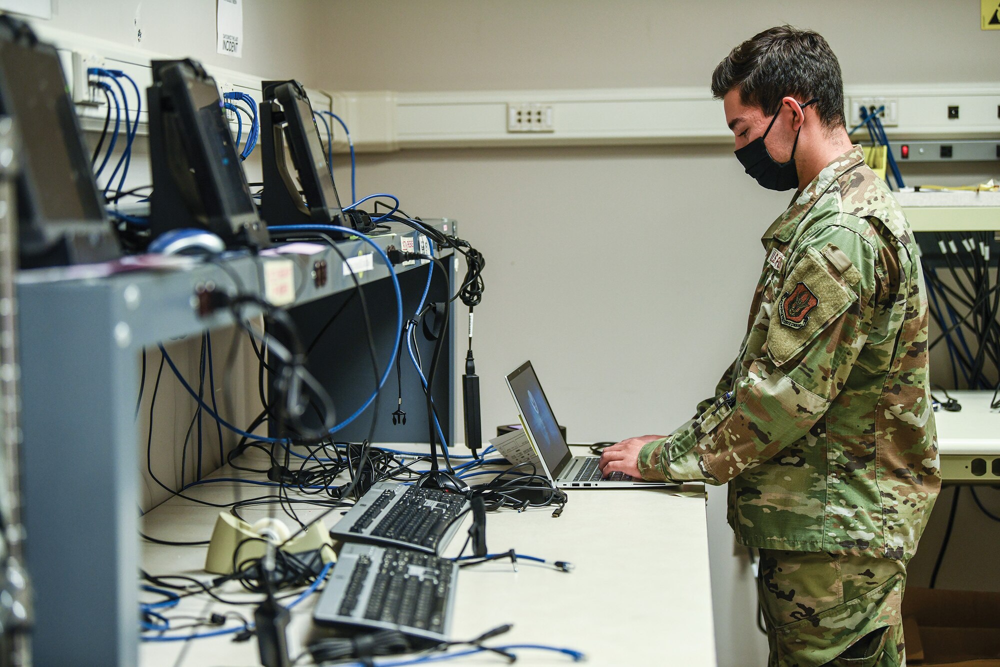 Senior Airman Charles Reano, 445th Force Support Squadron communications element client systems technician, reimages a computer Aug. 24, 2021.