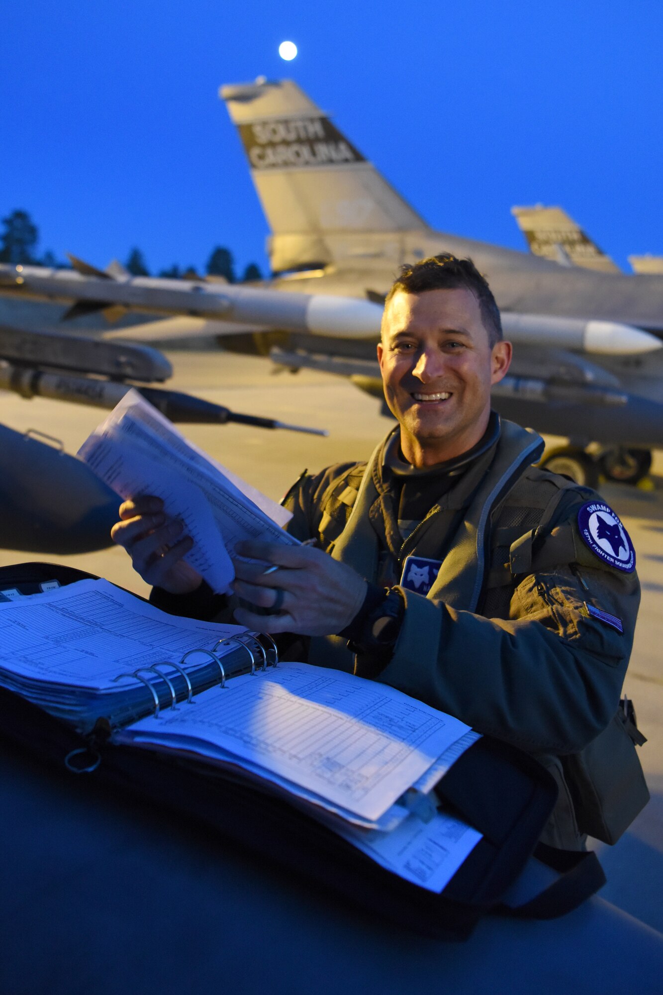 U.S. Air Force Lt. Col. Jeffrey Beckham, an F-16C Block 52 Fighting Falcon pilot assigned to the Air National Guard’s 169th Fighter Wing from McEntire Joint National Guard Base, S.C., completes aircraft status records after arriving at Kallax Air Base, Luleå, Sweden, May 16, 2019 in preparation for Arctic Challenge Exercise 2019. U.S. Air Force F-16C Block 52 Fighting Falcons arrive to participate in ACE 19. ACE19 is a Nordic aviation exercise, and this year will include participation from the Swedish, Norwegian, Danish, Finnish, French, German, Dutch, British, and U.S. forces. U.S. force’s participation, as part of the European Deterrence Initiative, demonstrates steadfast commitment to NATO allies and partners in Europe to remain resolute regional stability and security. (U.S. Air National Guard photo by Senior Master Sgt. Edward Snyder)