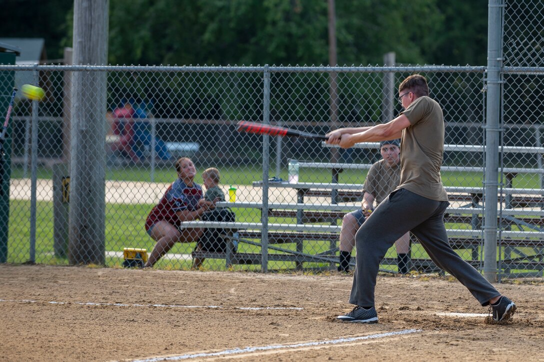 An Airman from the 4th Comptroller Squadron softball team, stationed at Seymour Johnson Air Force Base, hits a softball at Berkeley Park, North Carolina, Aug. 5, 2021.