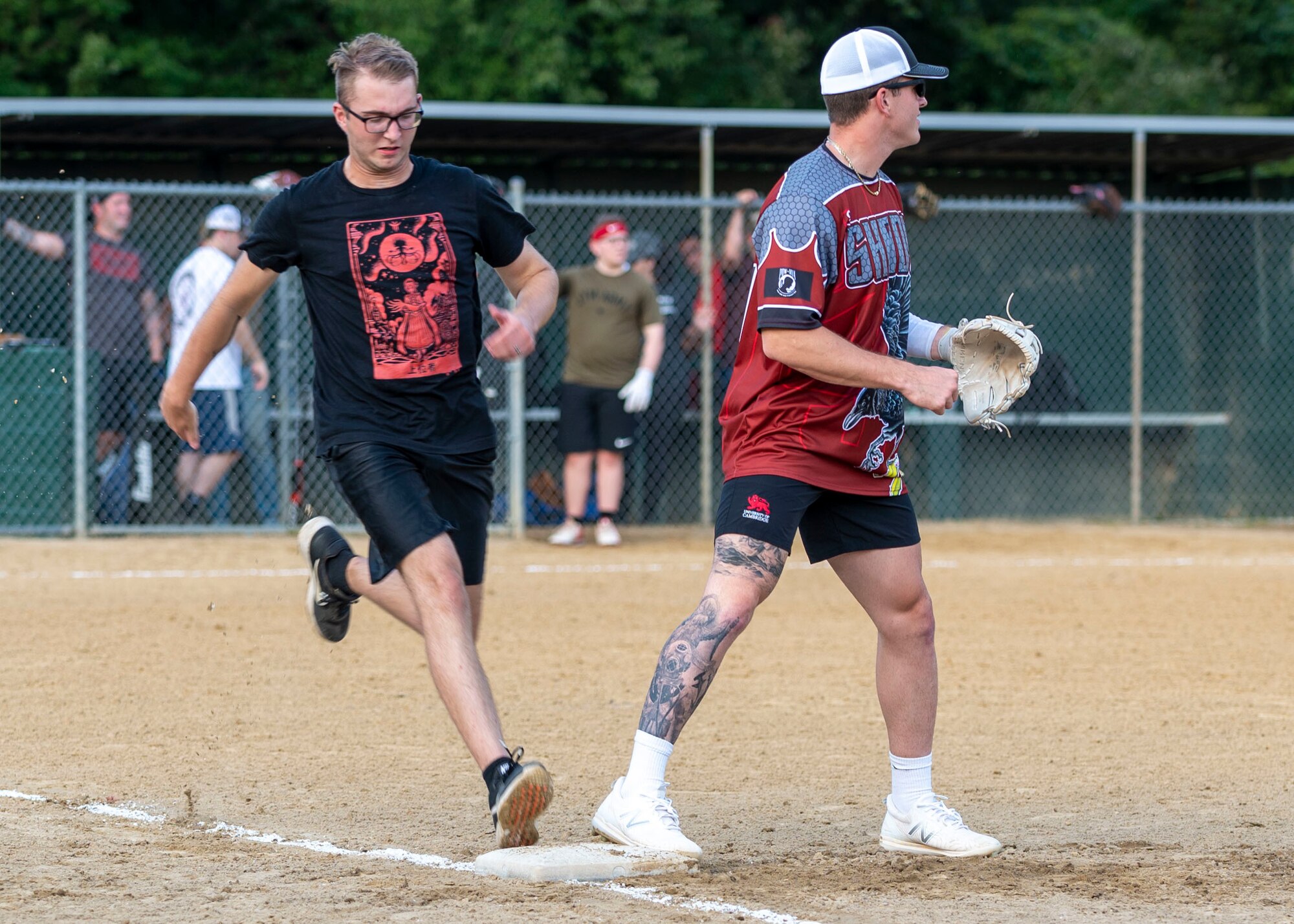 An Airman from the 4th Comptroller Squadron softball team, stationed at Seymour Johnson Air Force Base, runs to first base during a softball game against the 4th Munitions Squadron Team A at Berkeley Park, North Carolina, Aug. 5, 2021.