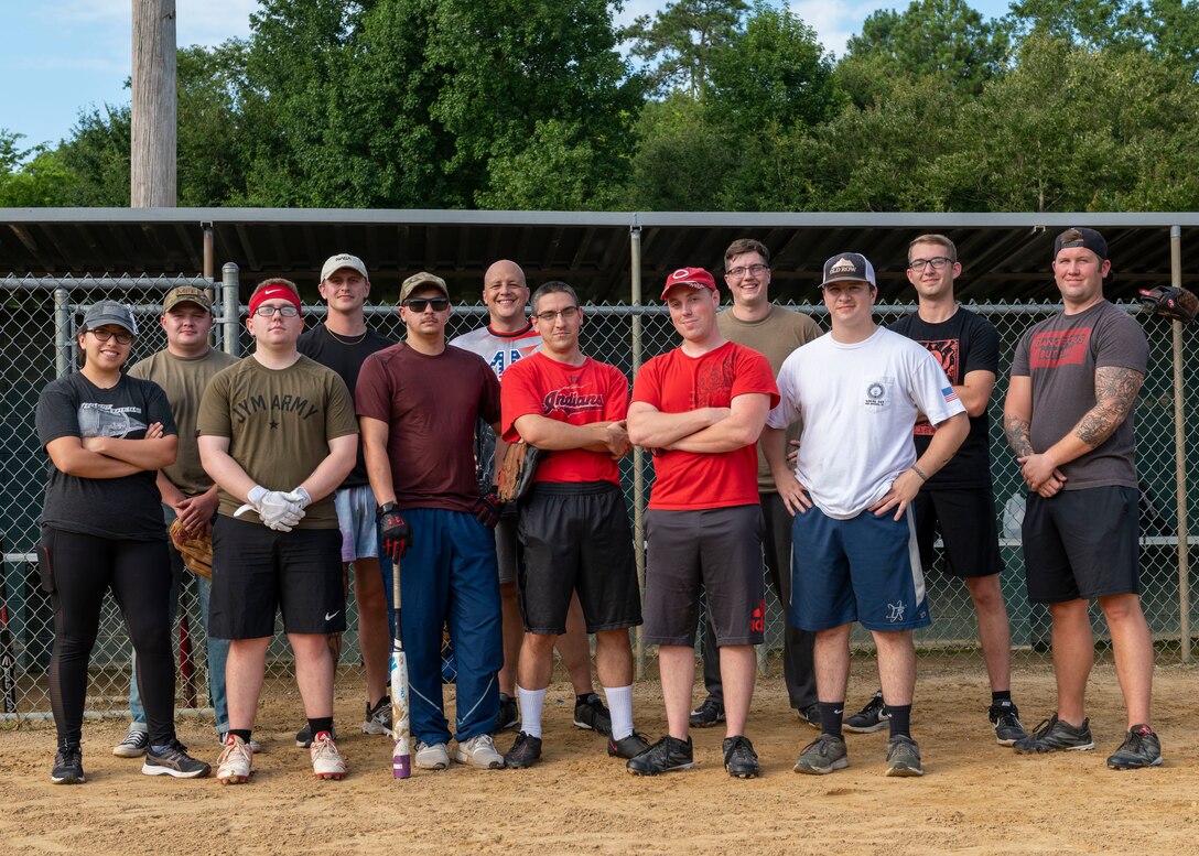 Members of Team Seymour from the 4th Comptroller Squadron at Seymour Johnson Air Force Base, pose for a photo prior to their softball game at Berkeley Park, North Carolina, Aug. 5, 2021.