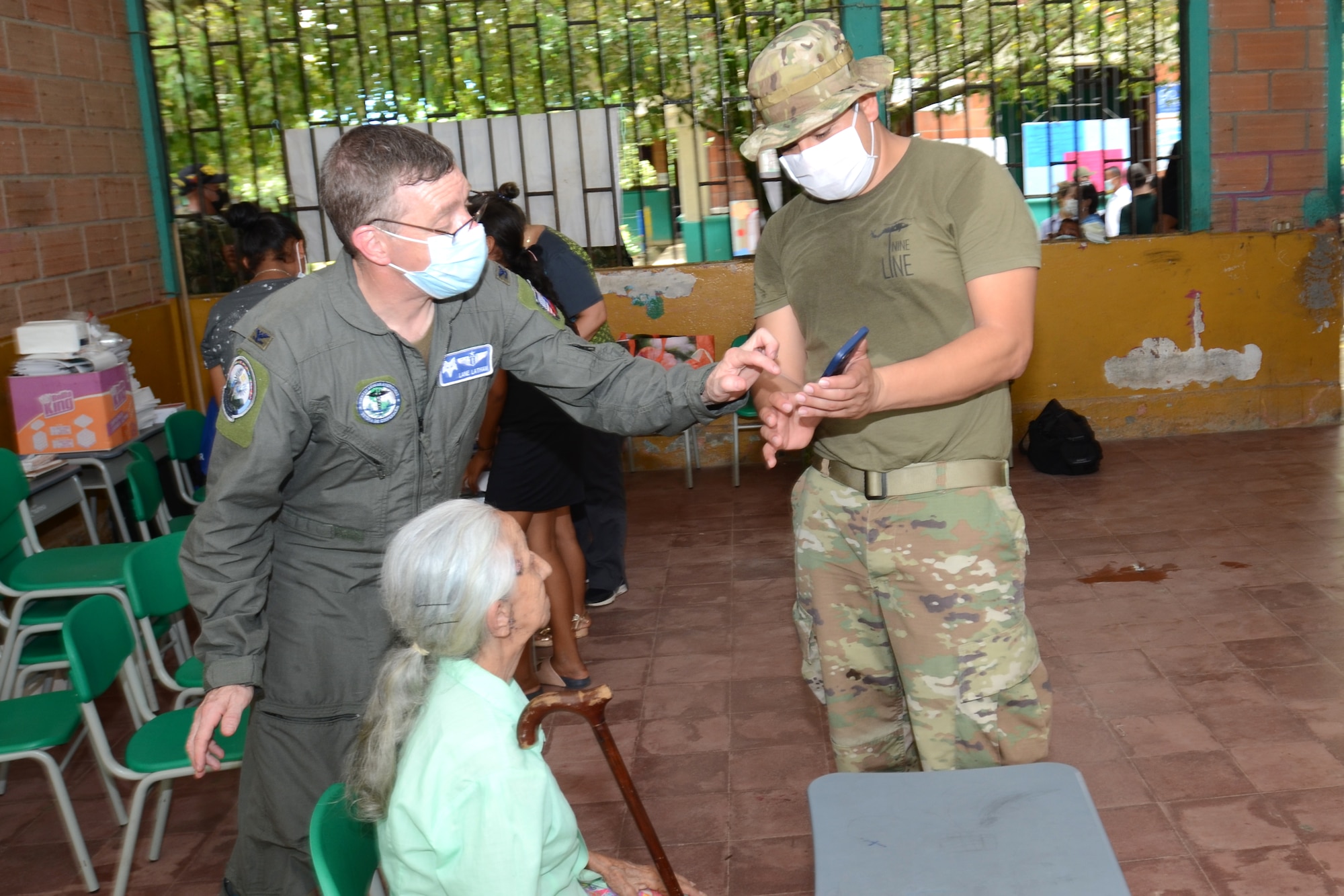 U.S. Air Force Col. Phillip Latham (left), 169th Medical Group Commander, and U.S. Army Specialist Pablo Morales, a medic, examine a Colombian patient Sepember 4, 2021. South Carolina National Guard medical personnel later traveled to the remote town of Tamana, Colombia to participate in a real-word community medical and humanitarian support mission. While there, the medical personnel provided dental, optical, dermatology, pharmacy and general medical care to more than 300 patients. South Carolina Air National Guard and South Carolina Army National Guard medical personnel participate in the regional Ángel de los Andes (Angel of the Andes) and Cooperación VII exercises in Colombia August 30 to September 10, 2021. The exercises provide training opportunities with South Carolina’s state partner Colombia in realistic combat search and rescue missions as well as humanitarian aid and disaster response scenarios such as earthquakes and tsunamis. (U.S. Air National Guard photo by Lt. Col. Jim St.Clair, 169th Fighter Wing Public Affairs)