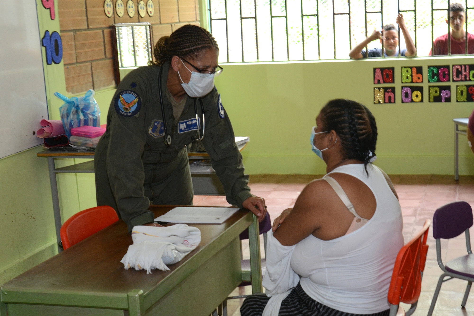 U.S. Air Force Lt. Col. Vanessa Wideman, a flight doctor with the 169th Medical Group, examines a Colombian patent September 4, 2021. Doctors and med techs from the South Carolina Air National Guard’s 169th Medical Group teamed up with medics from the South Carolina Army National Guard to travel to the remote town of Tamana, Colombia to participate in a real-word community medical and humanitarian support mission September 4, 2021. While there, the medical personnel provided dental, optical, dermatology, pharmacy and general medical care to more than 300 patients. South Carolina Air National Guard and South Carolina Army National Guard medical personnel participate in the regional Ángel de los Andes (Angel of the Andes) and Cooperación VII exercises in Colombia August 30 to September 10, 2021. The exercises provide training opportunities with South Carolina’s state partner Colombia in realistic combat search and rescue missions as well as humanitarian aid and disaster response scenarios such as earthquakes and tsunamis. (U.S. Air National Guard photo by Lt. Col. Jim St.Clair, 169th Fighter Wing Public Affairs)