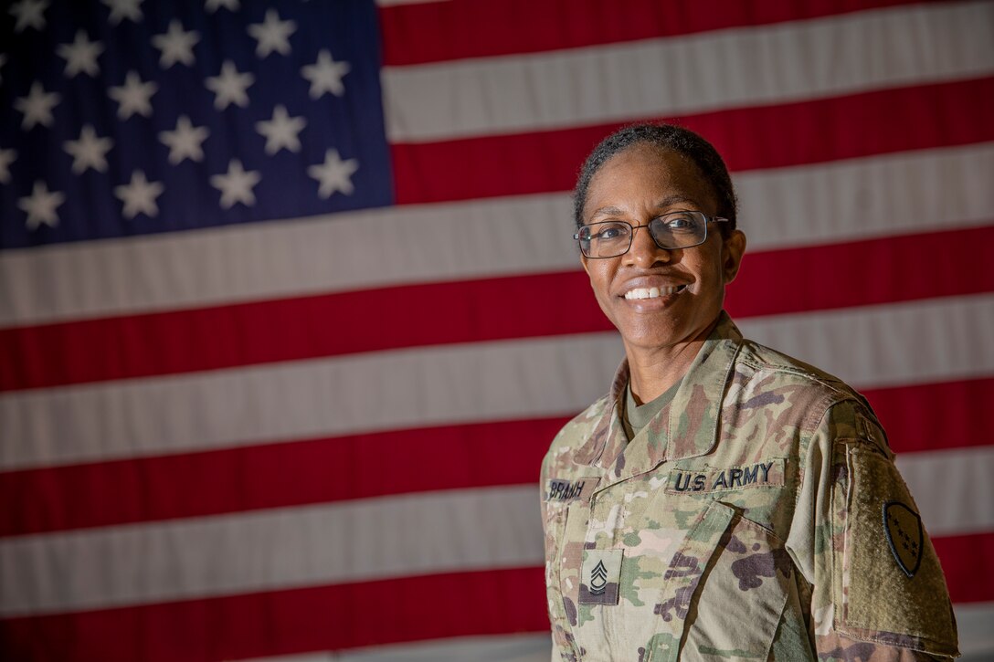 Master Sgt. Melissa Branch, the Alaska Army National Guard state religious affairs noncommissioned officer, poses for a photo at the Alaska National Guard Armory on Joint Base Elmendorf-Richardson, Alaska, Aug. 26, 2021. Branch, who was serving in the Marine Corps at the time when 9/11 happened, was stationed at the Navy Annex building next to the Pentagon in Washington, and was there when the American Airlines Flight 77 struck the Pentagon during the terrorist attack that sparked a 20-year-long war. (U.S. Army National Guard photo by Edward Eagerton)