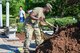 Master Sgt. Samuel Burke, Airman & Family Readiness Center readiness NCO, spreads mulch near the POW/MIA Monument at Hanscom Air Force Base, Mass., Aug. 31. Volunteers helped to spread mulch, pick weeds and clean up the area prior to a 9/11 ceremony on Sept. 10 and a POW/MIA ceremony on Sept. 16.