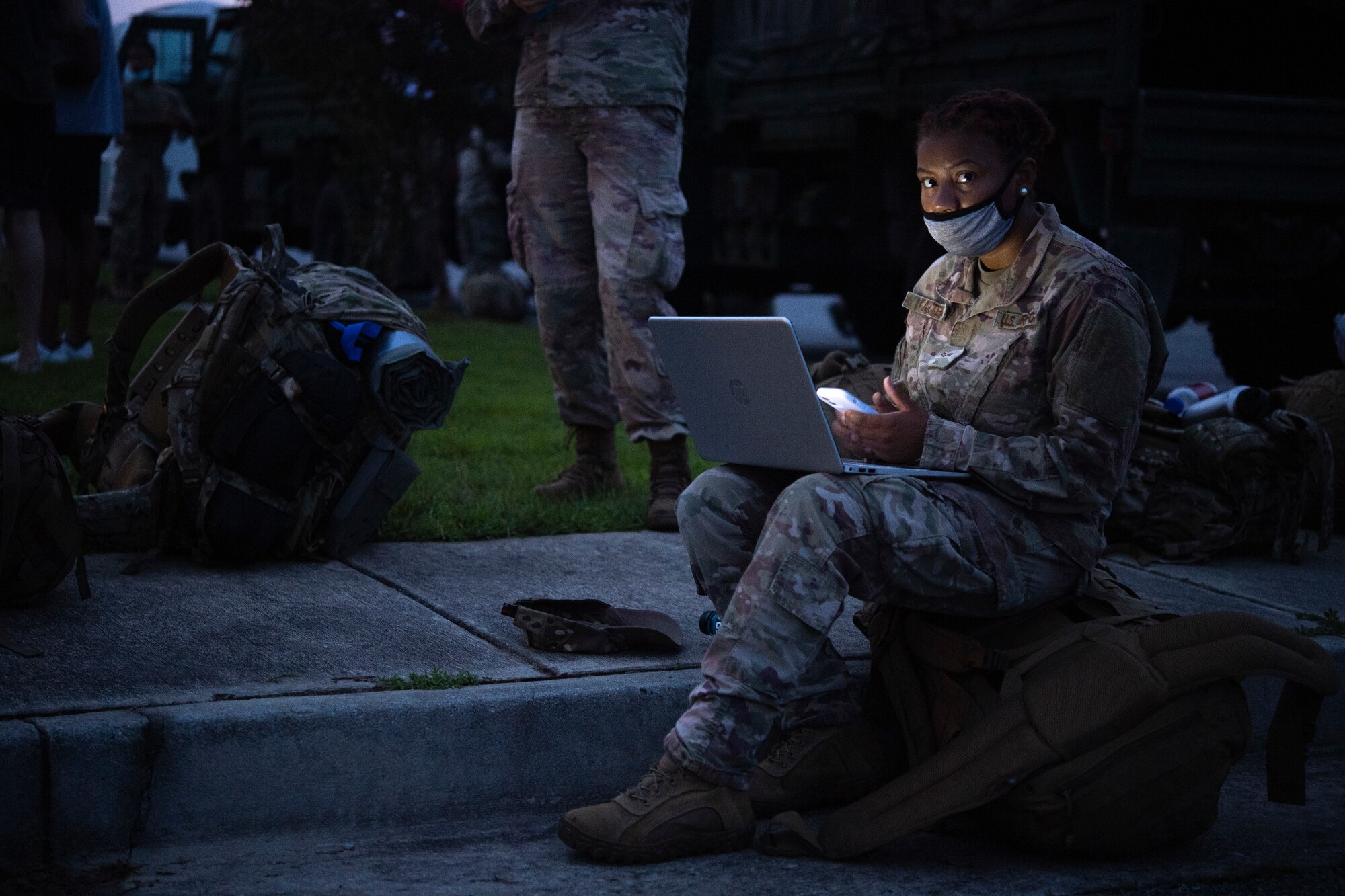 U.S. Air Force Senior Airman Kierra Carter, 822nd Base Defense Squadron fire team member, finishes a college homework assignment Aug. 28, 2021, prior to leaving Moody Air Force Base, Georgia, for Holloman Air Force Base, New Mexico, to support Afghan special immigrant visa applicants. The 822nd BDS is a self-sustaining force-protection unit and will provide an enhanced security presence at the temporary housing location in New Mexico in support of Task Force – Holloman. The Department of Defense, through U.S. Northern Command, and in support of the Department of Homeland Security, is providing transportation, temporary housing, medical screening, and general support for at least 50,000 Afghan evacuees at suitable facilities, in permanent or temporary structures, as quickly as possible. This initiative provides Afghan personnel essential support at secure locations outside Afghanistan. (U.S. Air Force photo by Master Sgt. Daryl Knee)