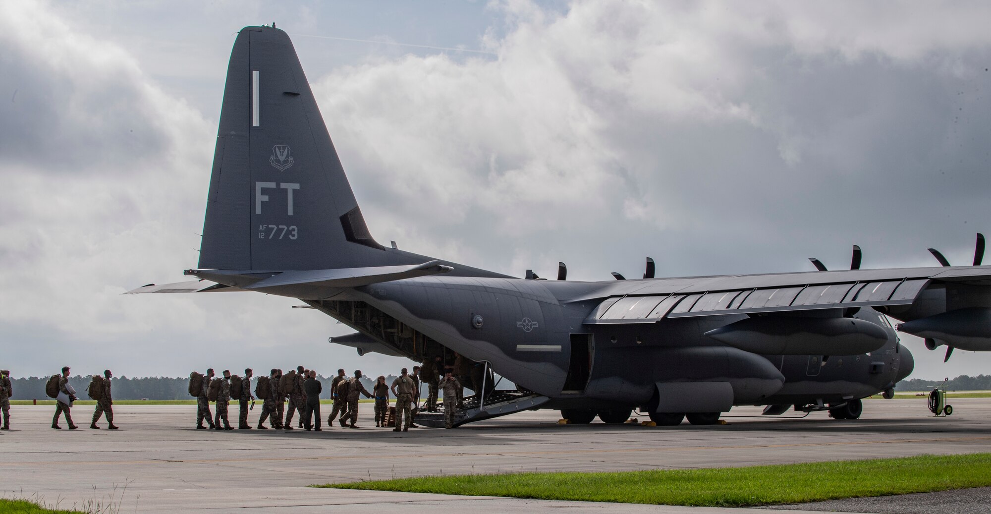 U.S. Air Force Airmen from the 822nd Base Defense Squadron load into an HC-130J Combat King II cargo aircraft from the 71st Rescue Squadron at Moody Air Force Base, Georgia, Aug. 29, 2021. More than 160 Airmen were transported to Holloman Air Force Base, New Mexico, in support of Task Force – Holloman. The Department of Defense, through U.S. Northern Command, and in support of the Department of Homeland Security, is providing transportation, temporary housing, medical screening, and general support for at least 50,000 Afghan evacuees at suitable facilities, in permanent or temporary structures, as quickly as possible. This initiative provides Afghan personnel essential support at secure locations outside Afghanistan. (U.S. Air Force photo by Master Sgt. Daryl Knee)