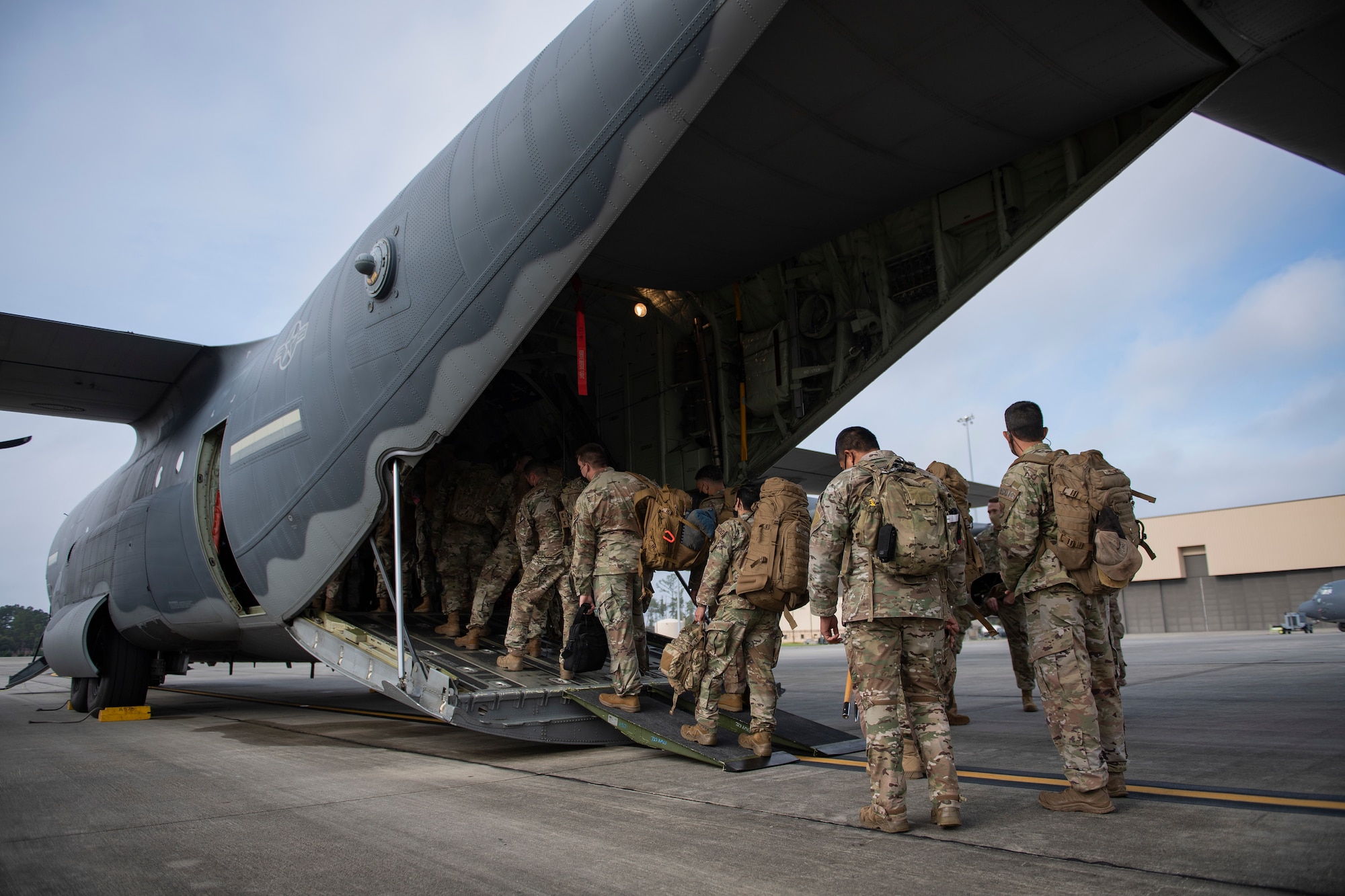 U.S. Air Force Airmen from the 822nd Base Defense Squadron load into an HC-130J Combat King II cargo aircraft from the 71st Rescue Squadron at Moody Air Force Base, Georgia, Aug. 28, 2021. More than 160 Airmen were transported to Holloman Air Force Base, New Mexico in support of Task Force – Holloman. The Department of Defense, through U.S. Northern Command, and in support of the Department of Homeland Security, is providing transportation, temporary housing, medical screening, and general support for up to 50,000 Afghan evacuees at suitable facilities, in permanent or temporary structures, as quickly as possible. This initiative provides Afghan personnel essential support at secure locations outside Afghanistan. (U.S. Air Force photo by Master Sgt. Daryl Knee)