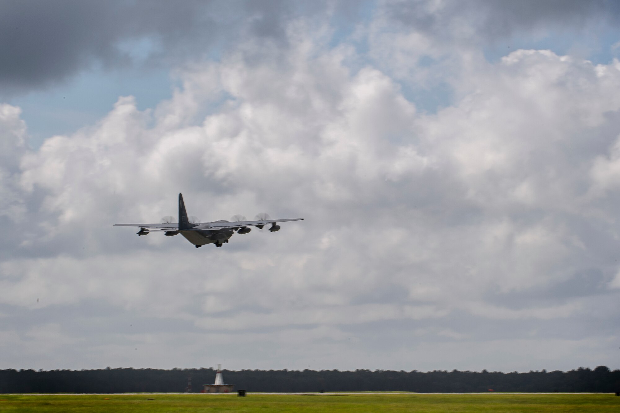 An HC-130J Combat King II cargo aircraft from the 71st Rescue Squadron departs Moody Air Force Base, Georgia, Aug. 29, 2021. The rescue squadron supplied the aircraft for the transportation of more than 160 members from the 822nd Base Defense Squadron to Holloman Air Force Base, New Mexico, in support of Task Force – Holloman. The Department of Defense, through U.S. Northern Command, and in support of the Department of Homeland Security, is providing transportation, temporary housing, medical screening, and general support for at least 50,000 Afghan evacuees at suitable facilities, in permanent or temporary structures, as quickly as possible. This initiative provides Afghan personnel essential support at secure locations outside Afghanistan. (U.S. Air Force photo by Master Sgt. Daryl Knee)