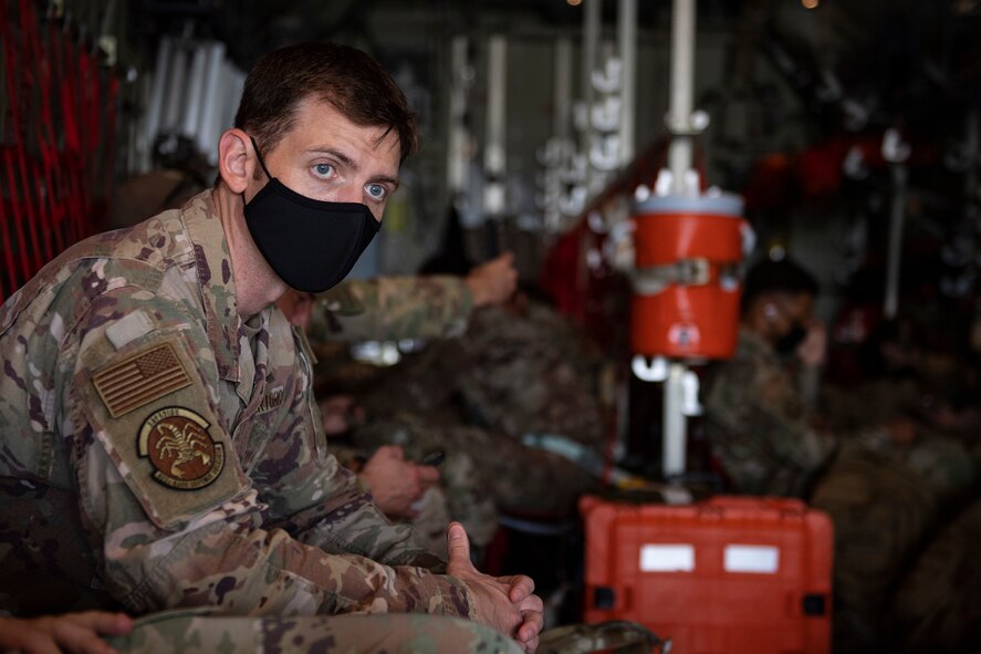 U.S. Air Force Maj. Timothy Funican, 822nd Base Defense Squadron commander, waits on an HC-130J Combat King II cargo aircraft with members from his unit at Moody Air Force Base, Georgia, Aug. 28, 2021. Funican is responsible for organizing, training and equipping Airmen of the 822nd BDS to provide the Secretary of Defense with a fully integrated defense capability, which enables Air Force, joint and coalition missions. (U.S. Air Force photo by Master Sgt. Daryl Knee)