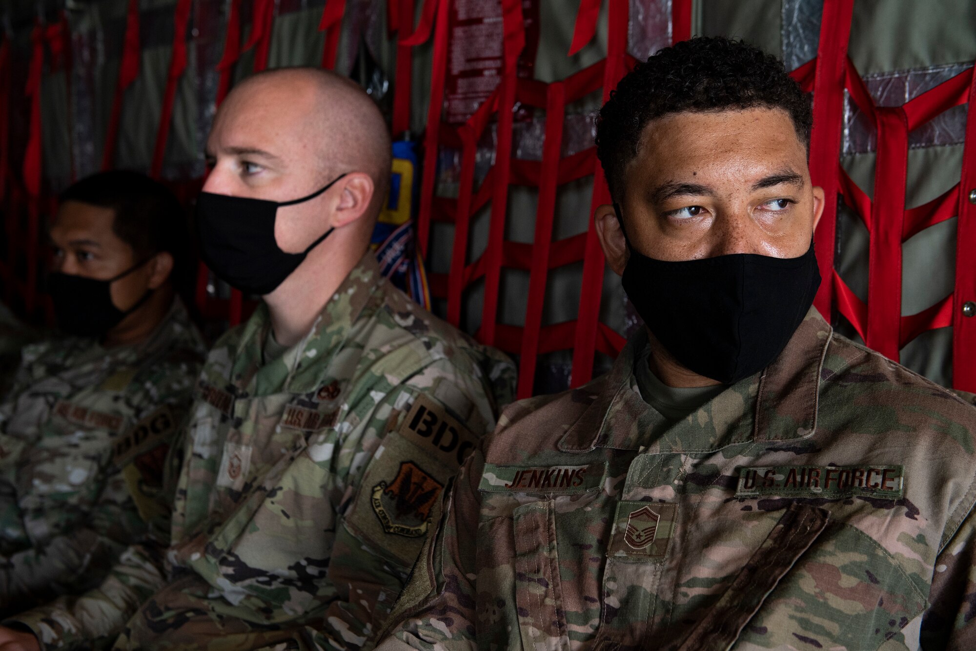 U.S. Air Force Senior Master Sgt. Kevin Jenkins, right, 822nd Base Defense Squadron operations superintendent, waits aboard an HC-130J Combat King II on Moody Air Force Base, Georgia, Aug. 28, 2021, prior to flying to Holloman Air Force Base, New Mexico. The 822nd BDS deployed in support of Task Force – Holloman. The Department of Defense, through U.S. Northern Command, and in support of the Department of Homeland Security, is providing transportation, temporary housing, medical screening, and general support for at least 50,000 Afghan evacuees at suitable facilities, in permanent or temporary structures, as quickly as possible. This initiative provides Afghan personnel essential support at secure locations outside Afghanistan. (U.S. Air Force photo by Master Sgt. Daryl Knee)