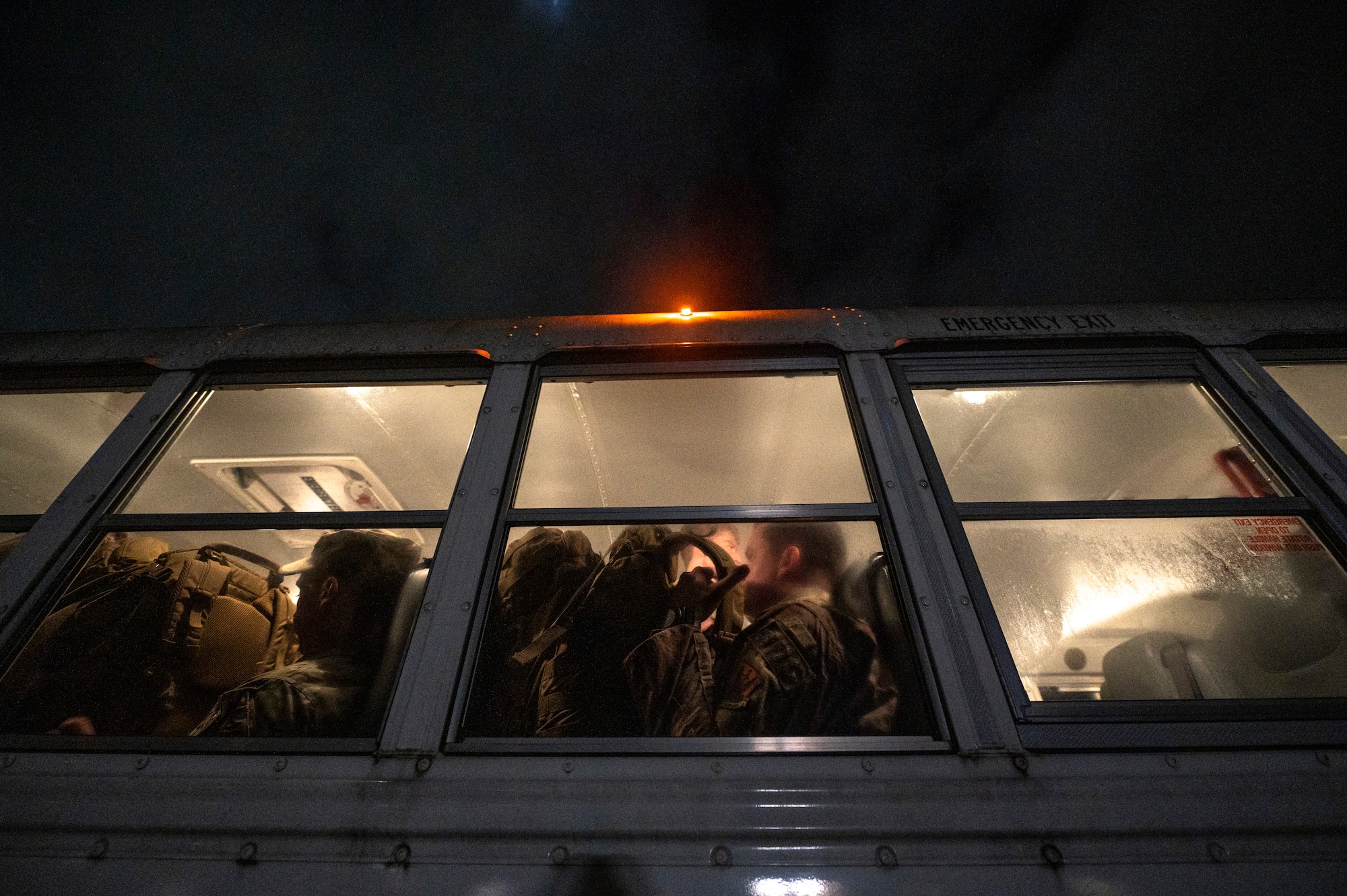 U.S. Air Force Airmen assigned to the 822nd Base Defense Squadron board a shuttle to be transported to the deployment control center at Moody Air Force Base, Georgia, Aug. 29, 2021. The 822nd BDS was tasked to provide an enhanced security presence at Holloman Air Force Base, New Mexico, in support of Task Force – Holloman. The Department of Defense, through U.S. Northern Command, and in support of the Department of Homeland Security, is providing transportation, temporary housing, medical screening, and general support for at least 50,000 Afghan evacuees at suitable facilities, in permanent or temporary structures, as quickly as possible. This initiative provides Afghan personnel essential support at secure locations outside Afghanistan. (U.S. Air Force photo by Staff Sgt. Devin Boyer)