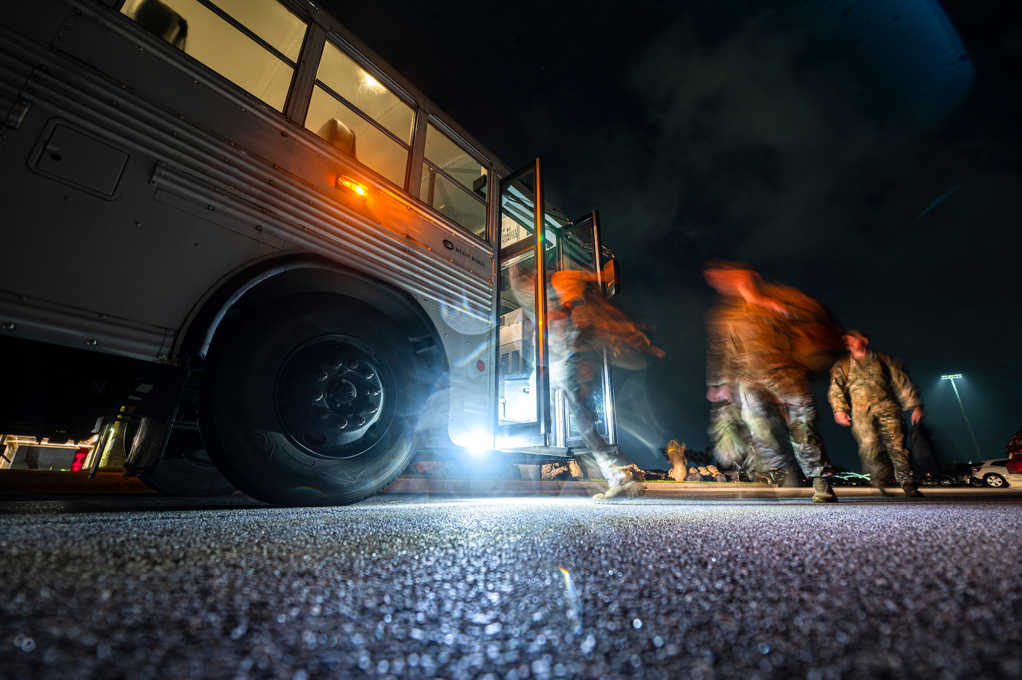 U.S. Air Force Airmen assigned to the 822nd Base Defense Squadron board a shuttle to be transported to the deployment control center at Moody Air Force Base, Georgia, Aug. 29, 2021. The 822nd BDS were tasked to provide an enhanced security presence at Holloman Air Force Base, New Mexico in support of Task Force – Holloman. The Department of Defense, through U.S. Northern Command, and in support of the Department of Homeland Security, is providing transportation, temporary housing, medical screening, and general support for at least 50,000 Afghan evacuees at suitable facilities, in permanent or temporary structures, as quickly as possible. This initiative provides Afghan personnel essential support at secure locations outside Afghanistan. (U.S. Air Force photo by Staff Sgt. Devin Boyer)