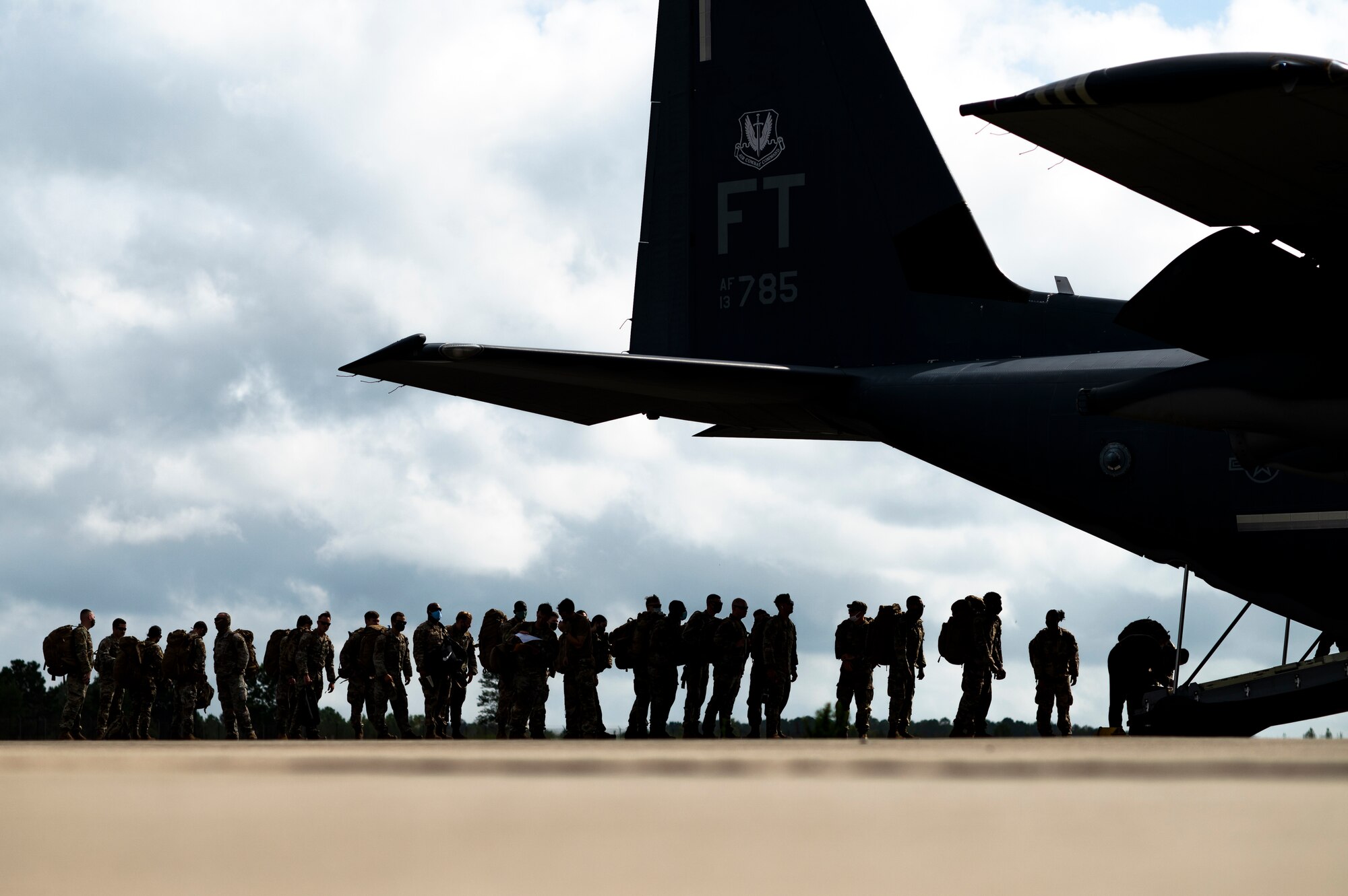 U.S. Air Force Airmen assigned to the 822nd Base Defense Squadron board an HC-130J Combat King II aircraft at Moody Air Force Base, Georgia, Aug. 29, 2021. The 822nd BDS were tasked to provide an enhanced security presence at Holloman Air Force Base, New Mexico, in support of Task Force – Holloman. The Department of Defense, through U.S. Northern Command, and in support of the Department of Homeland Security, is providing transportation, temporary housing, medical screening, and general support for at least 50,000 Afghan evacuees at suitable facilities, in permanent or temporary structures, as quickly as possible. This initiative provides Afghan personnel essential support at secure locations outside Afghanistan. (U.S. Air Force photo by Staff Sgt. Devin Boyer)