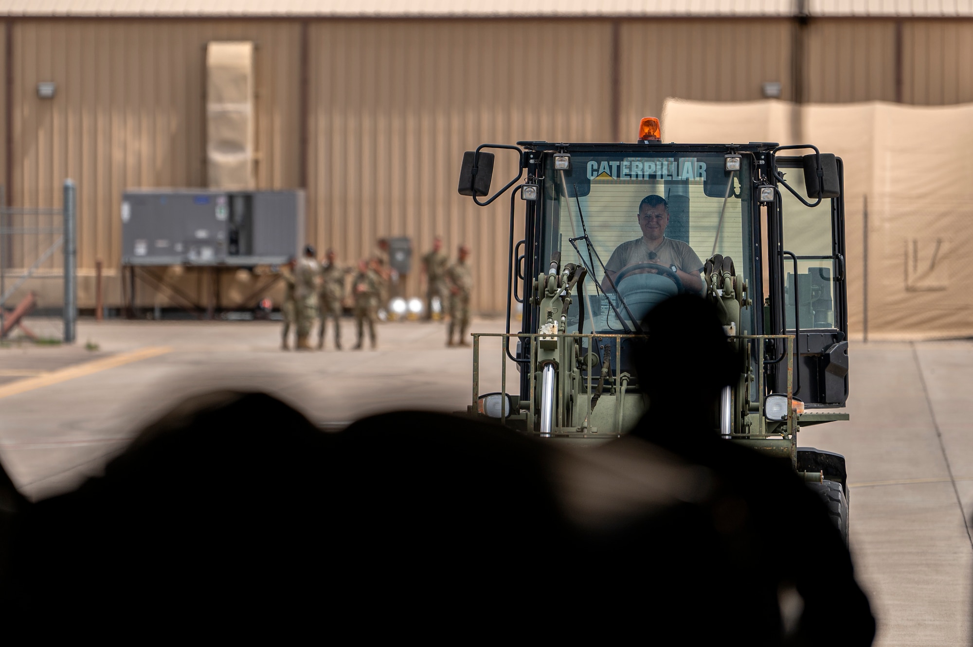 A U.S. Air Force Airman assigned to Holloman Air Force Base, New Mexico, operates a forklift to download luggage from an HC-130J Combat King II aircraft on the flightline at Holloman AFB, Aug. 29, 2021. The 71st Rescue Squadron transported 822nd Base Defense Squadron Airmen from Moody Air Force Base, Georgia, to Holloman AFB in support of Task Force – Holloman. The Department of Defense, through U.S. Northern Command, and in support of the Department of Homeland Security, is providing transportation, temporary housing, medical screening, and general support for at least 50,000 Afghan evacuees at suitable facilities, in permanent or temporary structures, as quickly as possible. This initiative provides Afghan personnel essential support at secure locations outside Afghanistan. (U.S. Air Force photo by Staff Sgt. Devin Boyer)