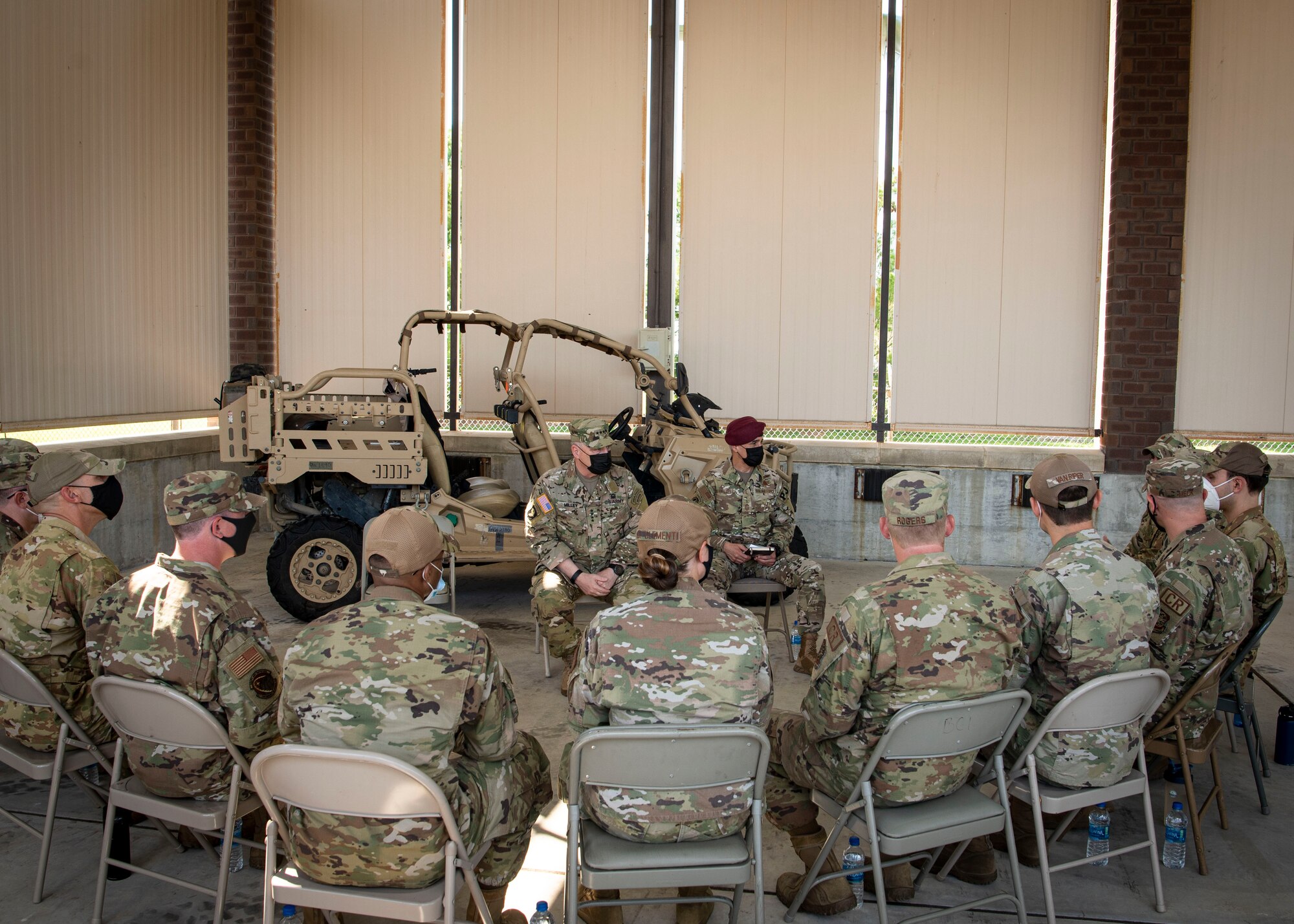 Photo of Airmen sitting around U.S. Army Gen. Mark Milley, the 20th Chairman of the Joint Chiefs of Staff, at Joint Base McGuire-Dix-Lakehurst, N.J.